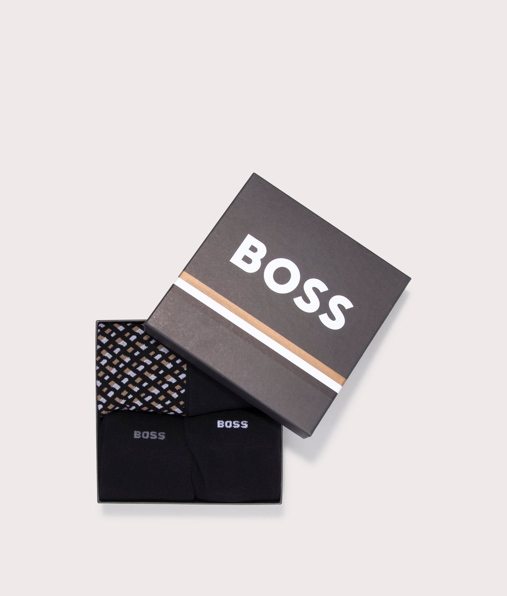 BOSS 4 Pack RS Monogrammed Socks in Black with Beige and White details at EQVVS Menswear. Gift box shot.