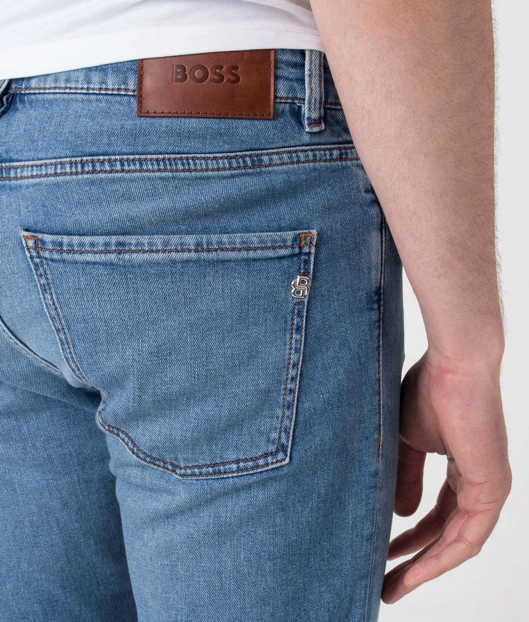 BOSS Slim Fit Delaware Jeans in Bright Blue . Shot at EQVVS. Back logo shot 