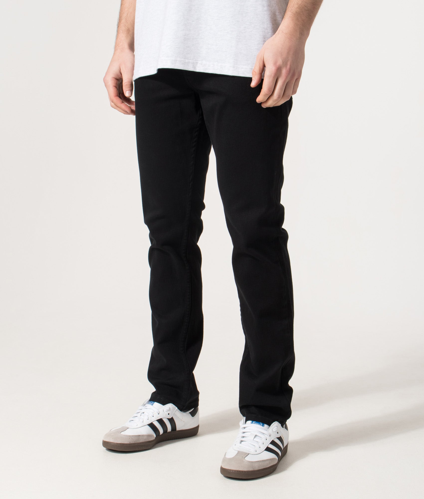 Slim Fit Delaware Jeans in Black | EQVVS | Front angle model shot 