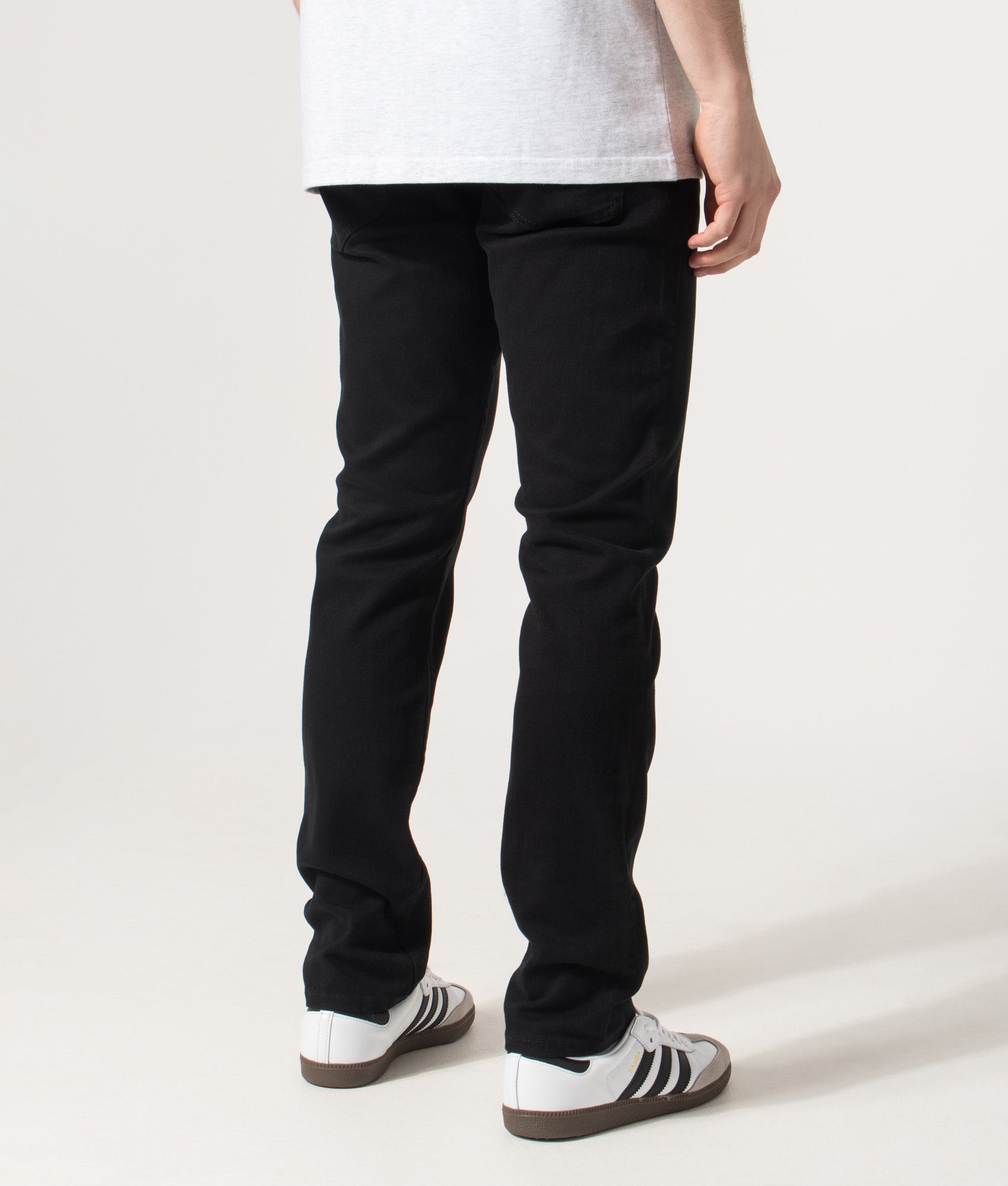 Slim Fit Delaware Jeans in Black | EQVVS | Back angle model shot 