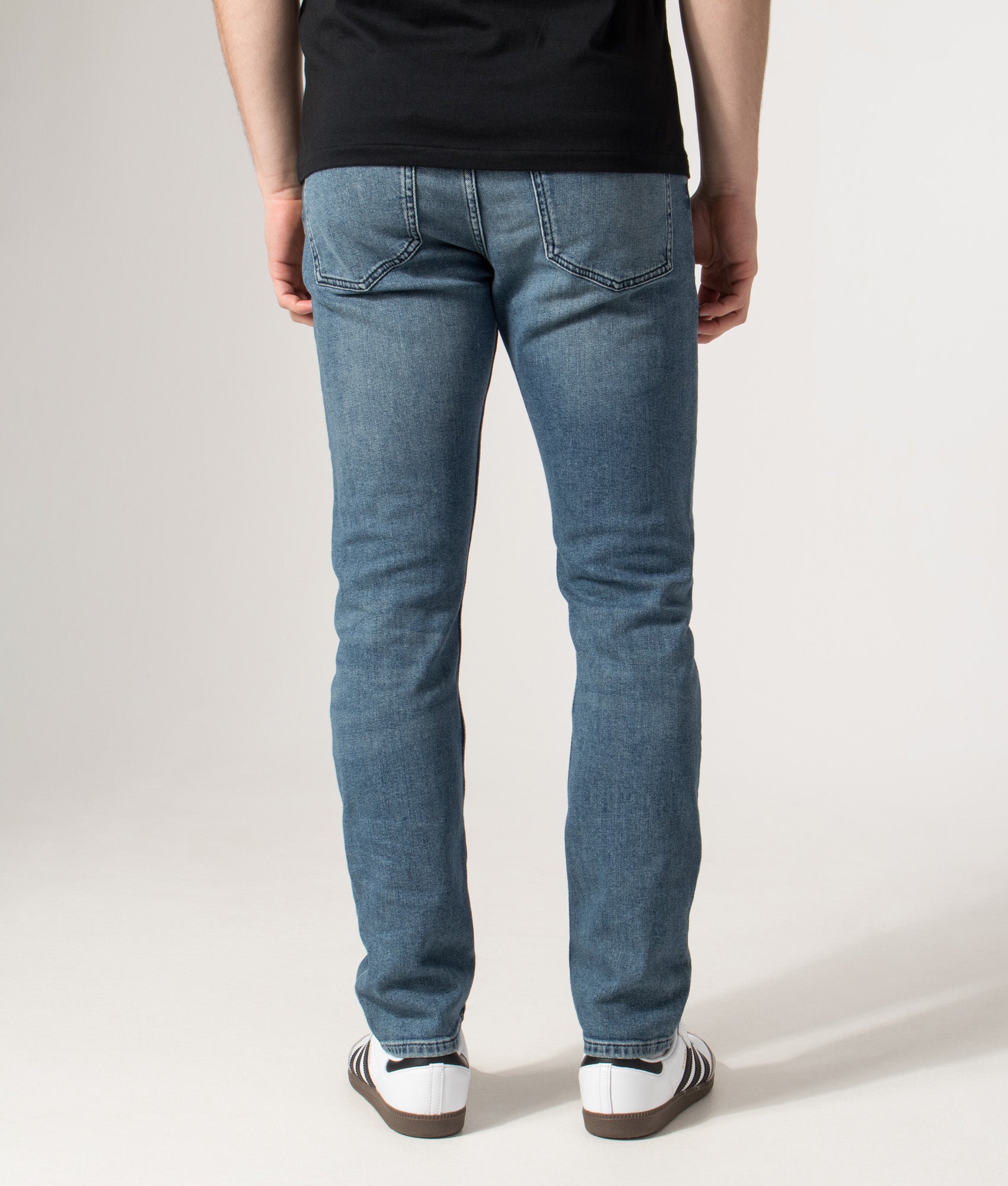 Slim Fit Delaware Jeans in Medium Blue | EQVVS | Back model shot 