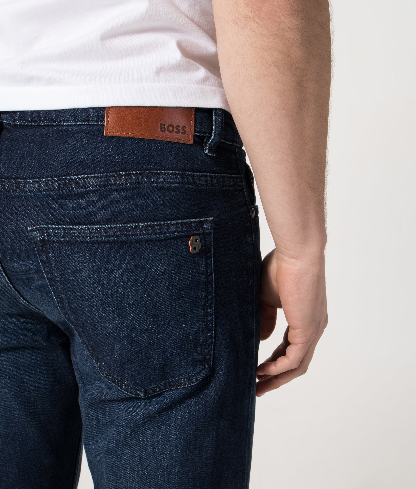 BOSS Slim Fit Delaware Jeans in the Dark Blue at EQVVS Menswear. Back detail shot.