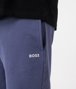 Waffle Shorts in Navy by BOSS. EQVVS Model Shot.