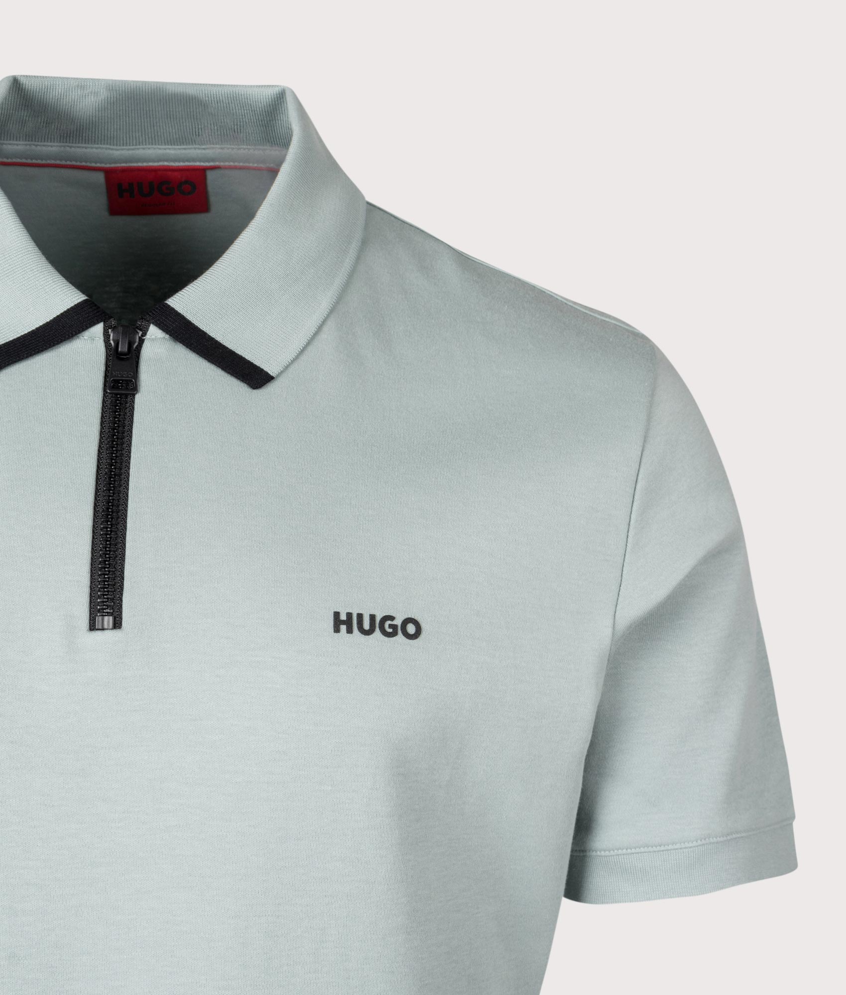 HUGO Dalomino Polo Shirt in Open Grey. Detail angle shot at EQVVS.