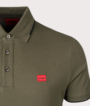 HUGO Slim Fit Deresino 232 Polo Shirt in Dark Beige. 100% Cotton. At EQVVS Menswear. Front logo shot