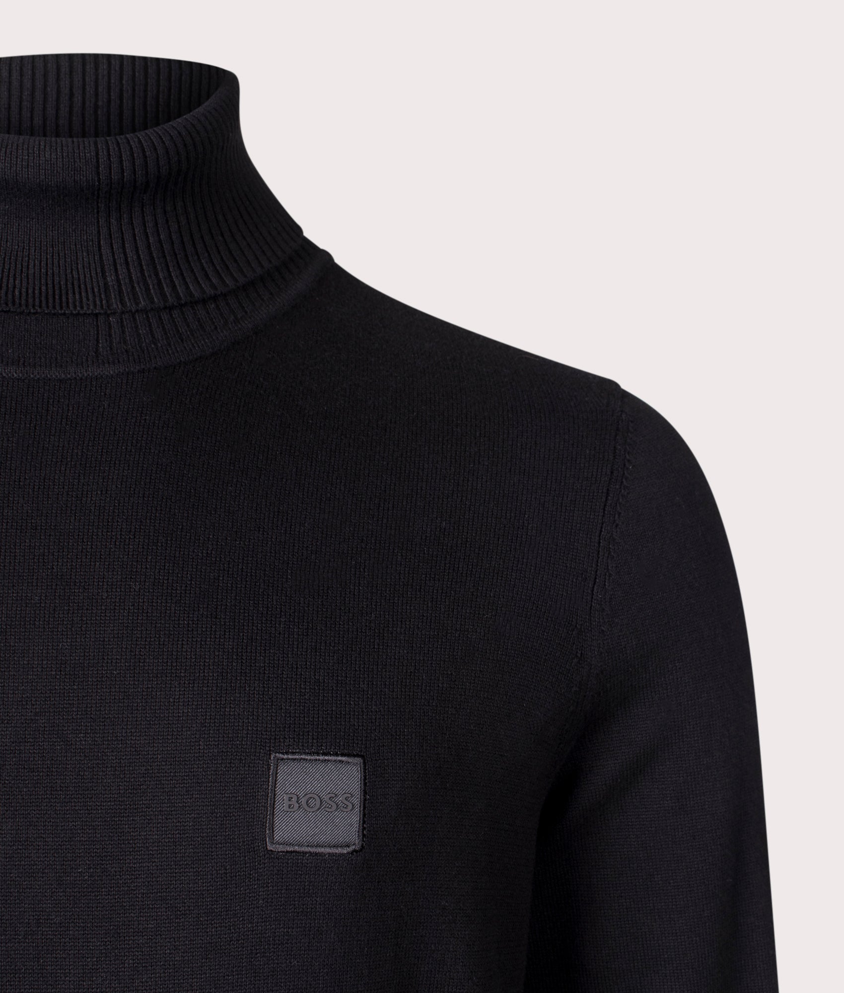 BOSS Akiro Rollneck Jumper in Black, Cotton/Cashmere Blend. At EQVVS Menswear. Front logo shot