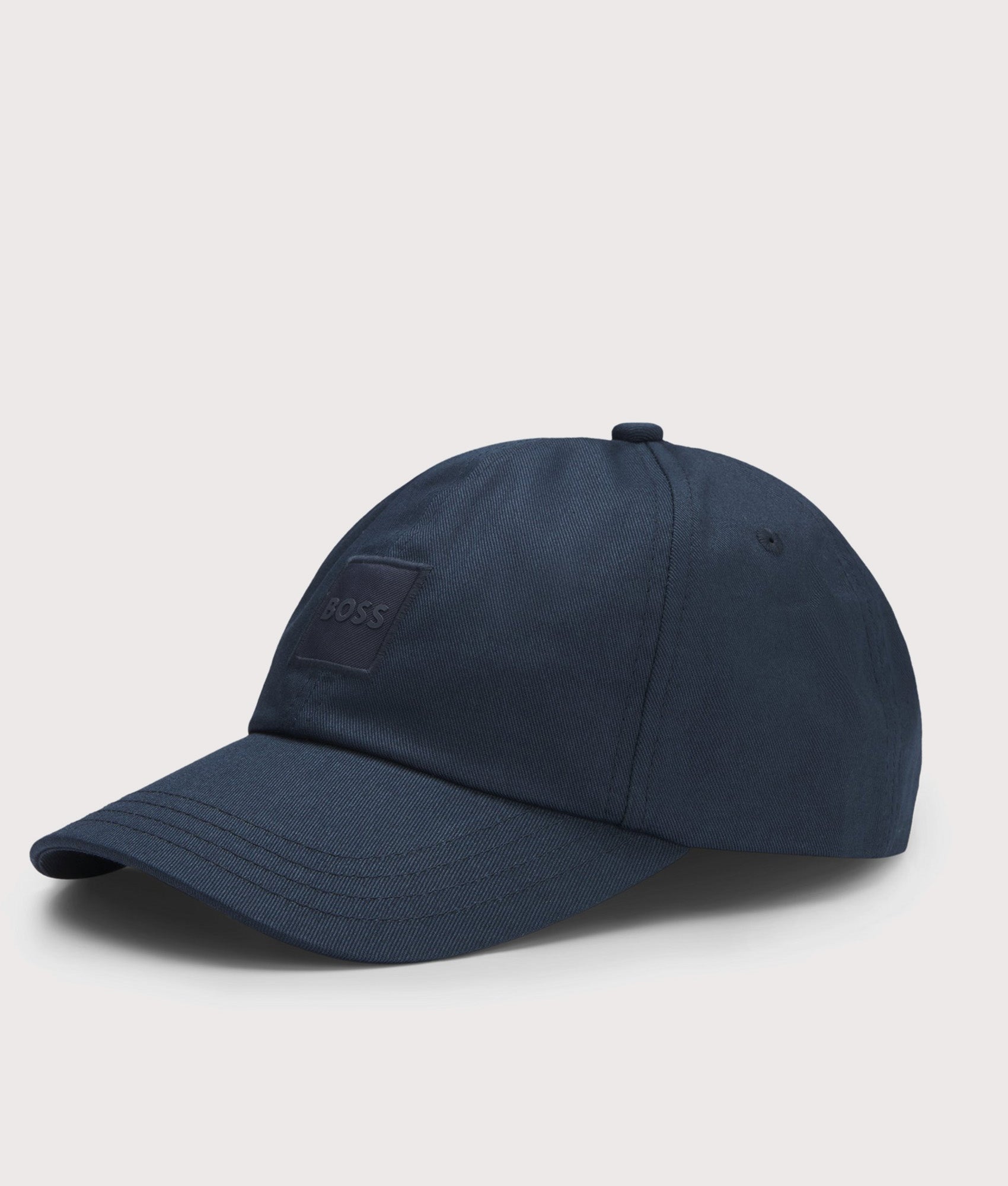 BOSS Derrel PL Cap in Dark Blue at EQVVS Menswear. Angled front shot.