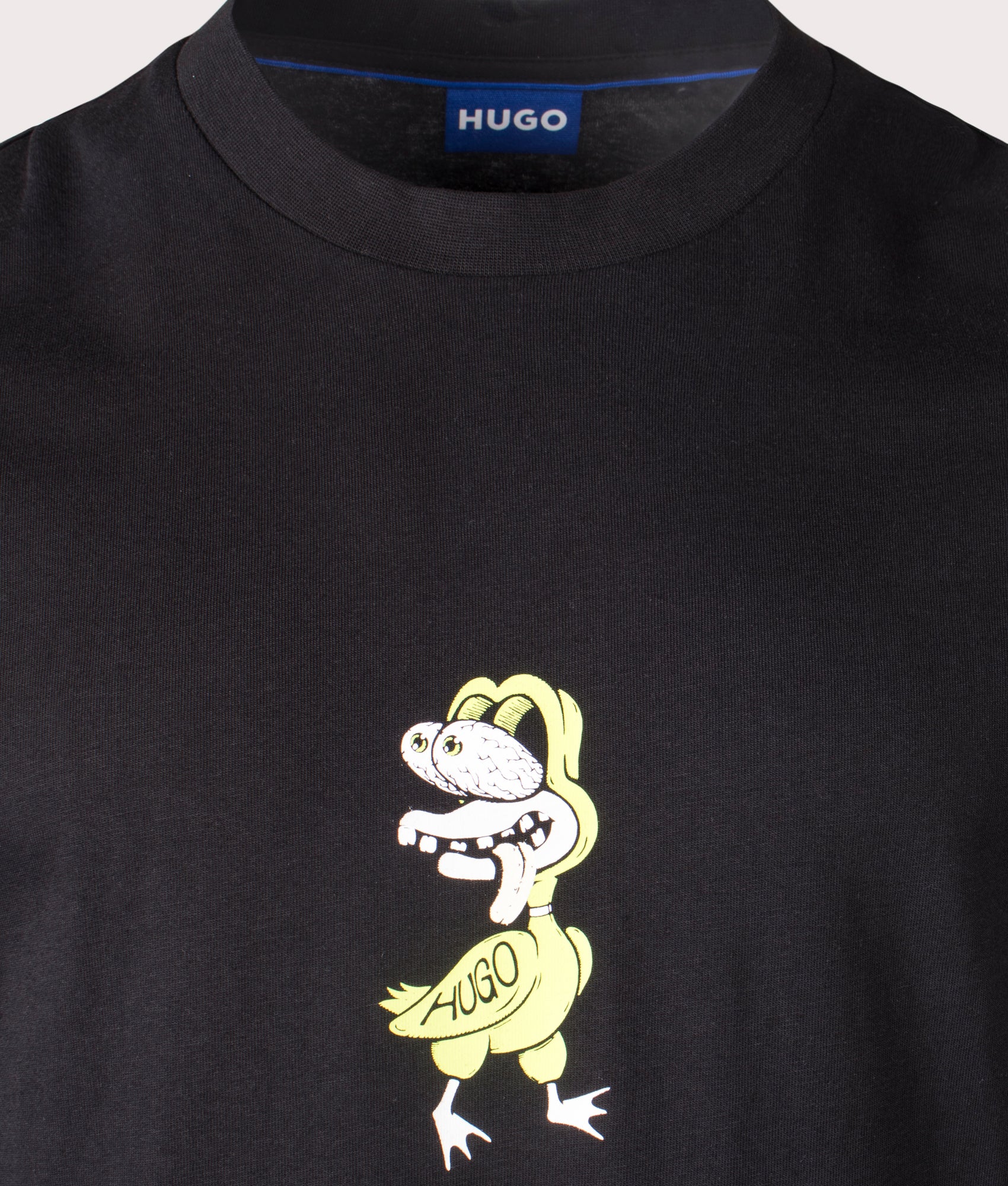 HUGO Nutongo T-Shirt in black, 100% cotton at EQVVS. Detailed logo shot. 