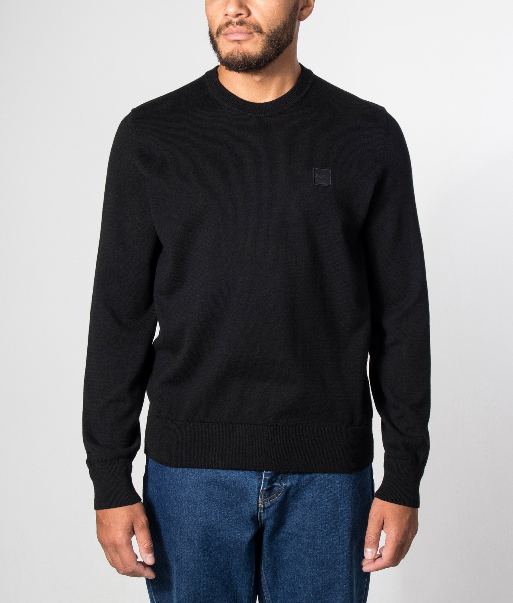 BOSS Kanovano Knitted Jumper in Black at EQVVS Menswear. Model front shot.