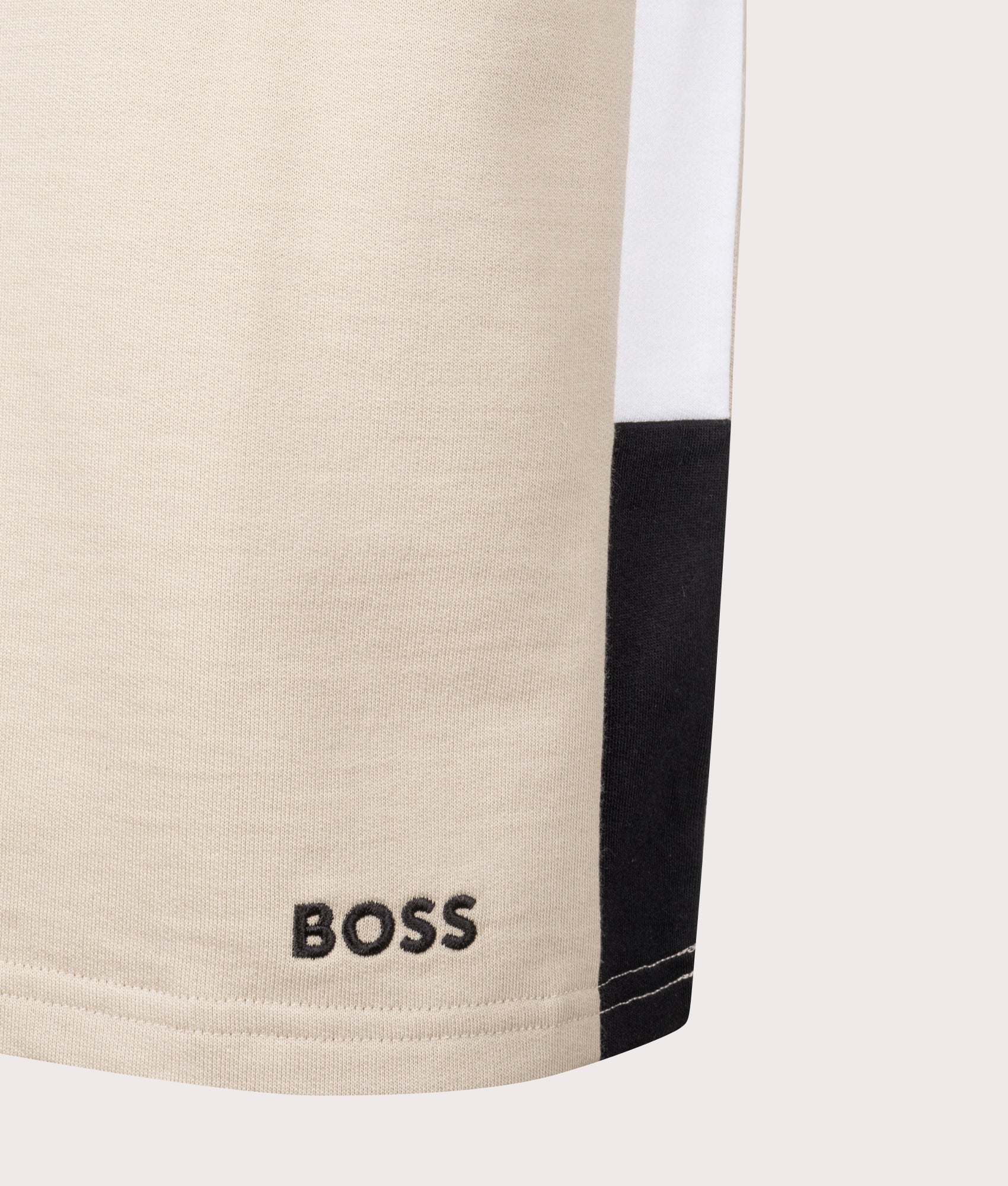 BOSS Iconic T-Shirt in Light Beige . Shot at EQVVS. Front logo shot 