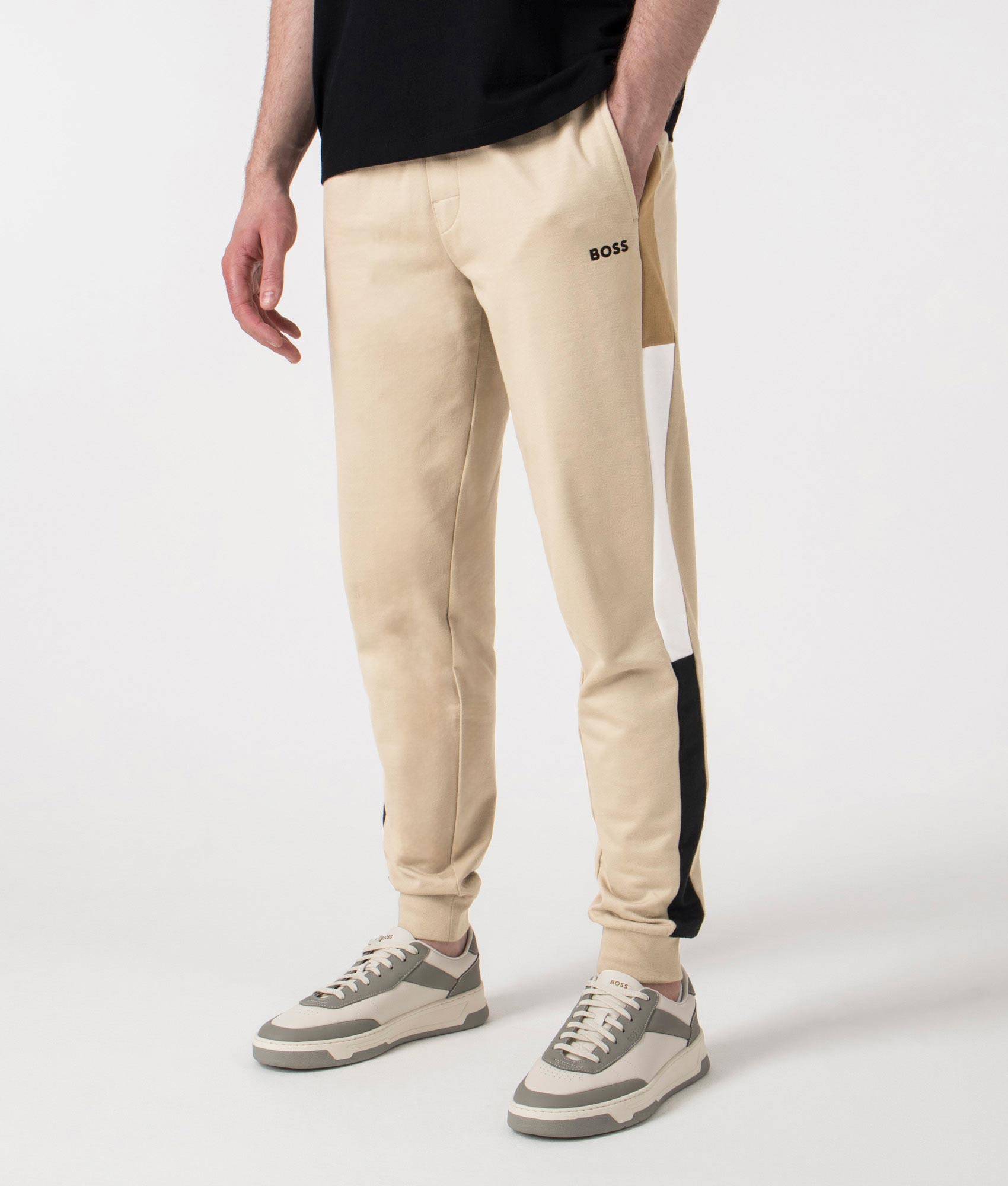BOSS Iconic Joggers in Light Beige at EQVVS. Angle Shot.