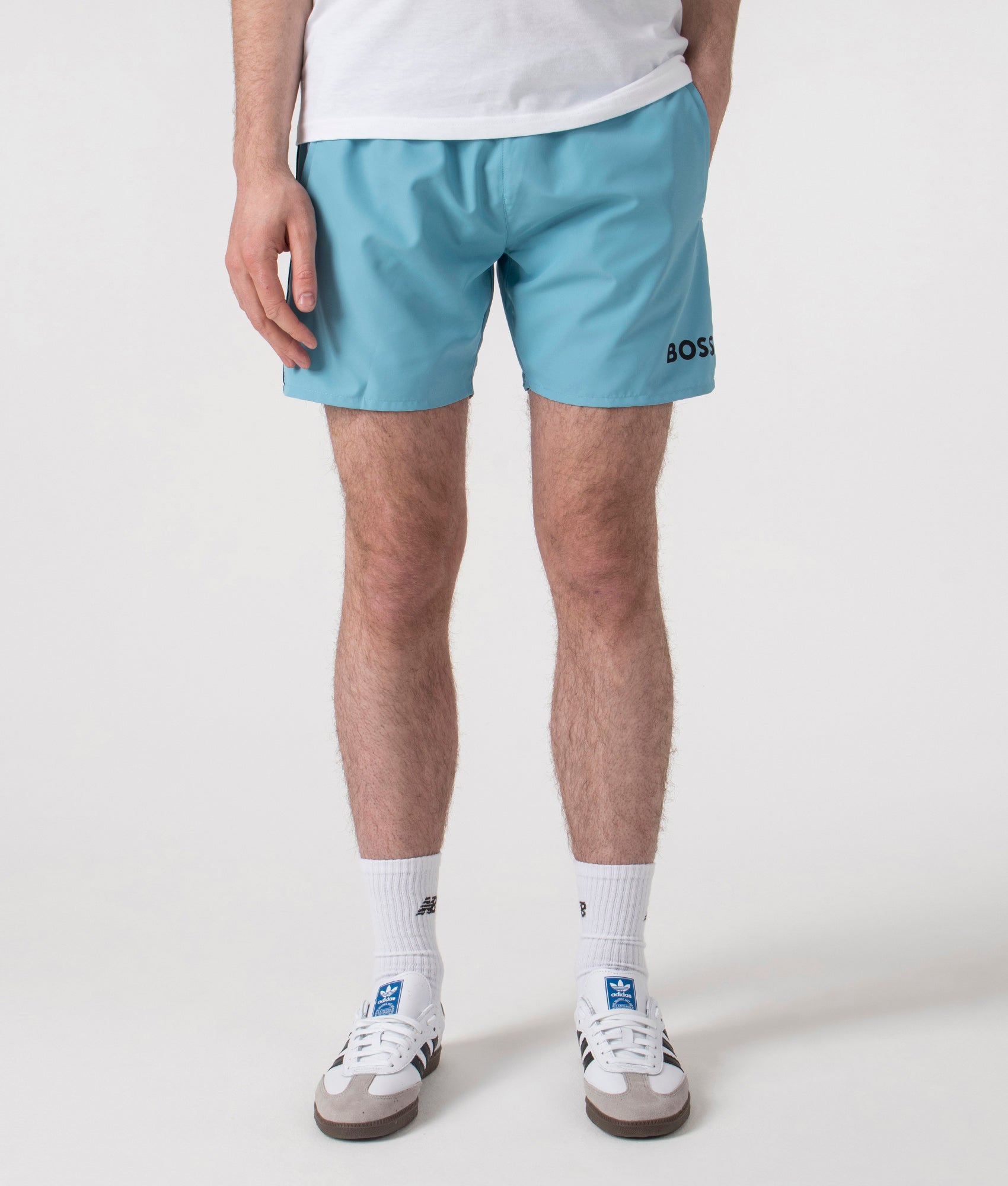 BOSS Starfish Swim Shorts in Light/Pastel blue at EQVVS. Front Shot.