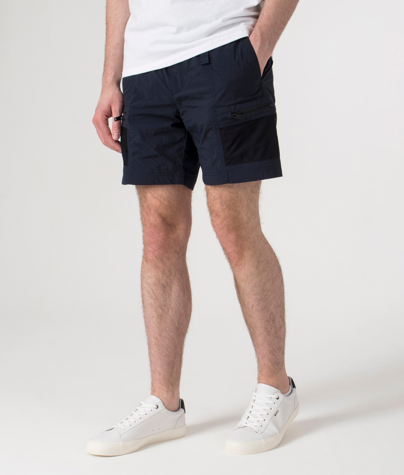BOSS Sal Cargo Shorts in Dark Blue at EQVVS. Angle shot.