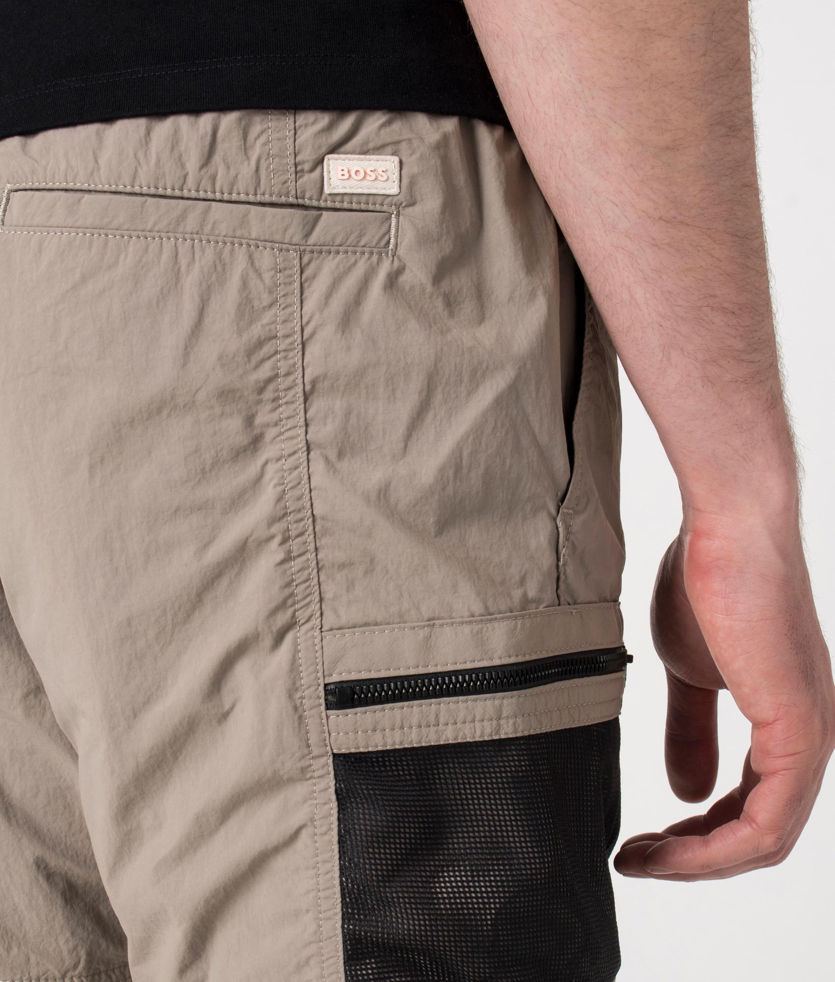 BOSS Sal Cargo Shorts in Open Beige at EQVVS. Detail shot.