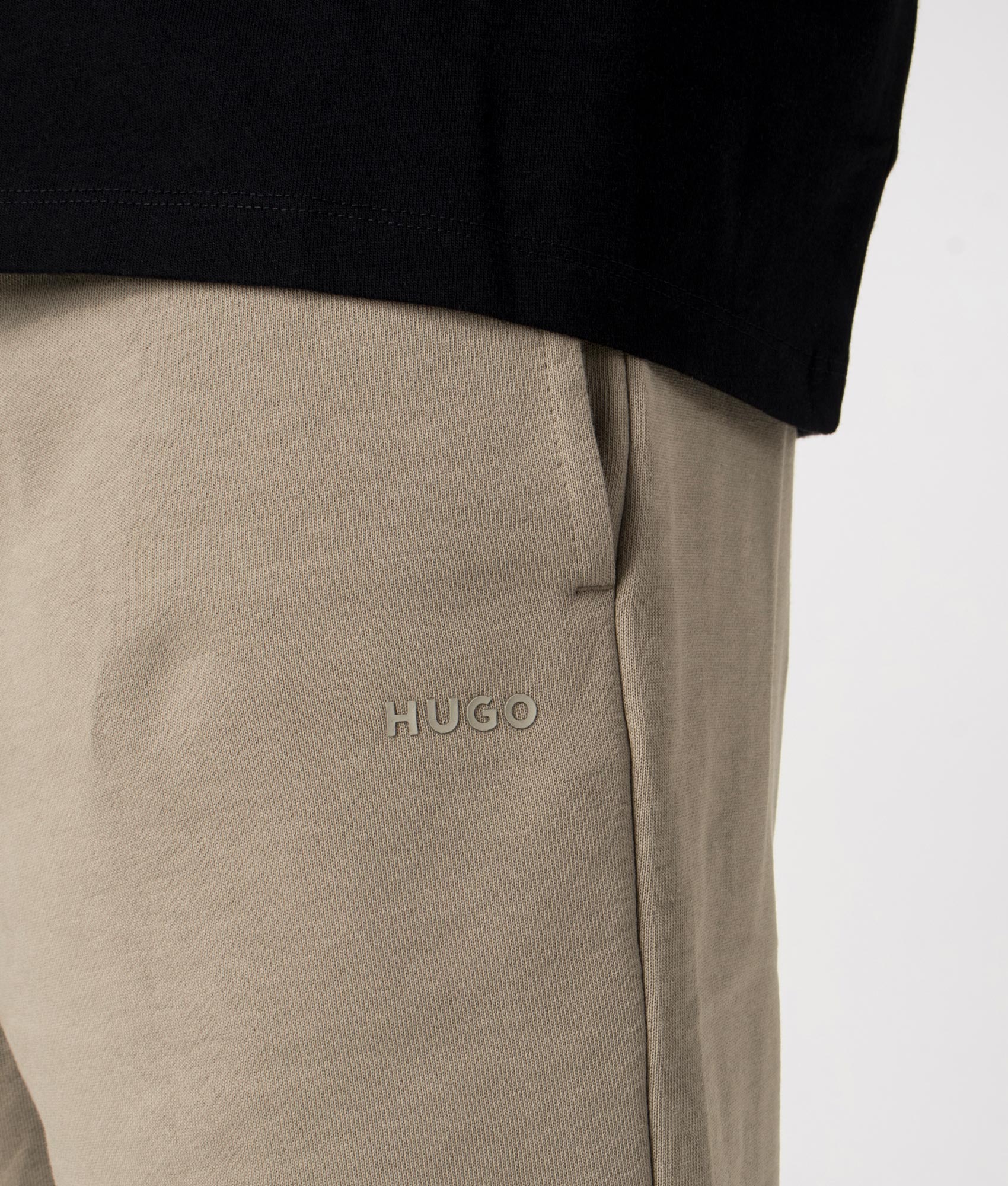HUGO Relaxed Fit Dayono Shorts in Medium Brown at EQVVS. Close-up shot. 