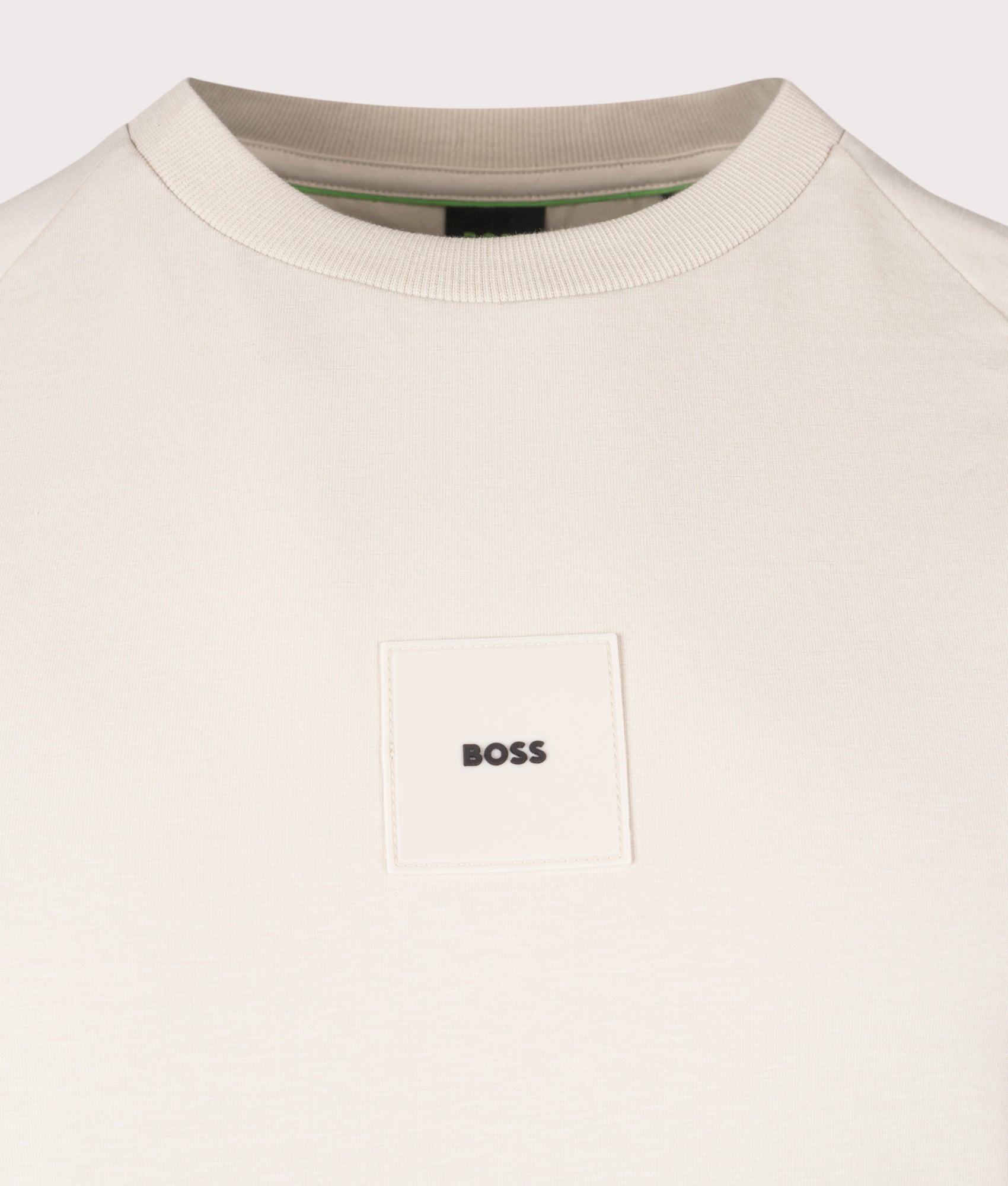 BOSS Tee Rib T-Shirt in Open Beige . Shot at EQVVS. Front logo shot 