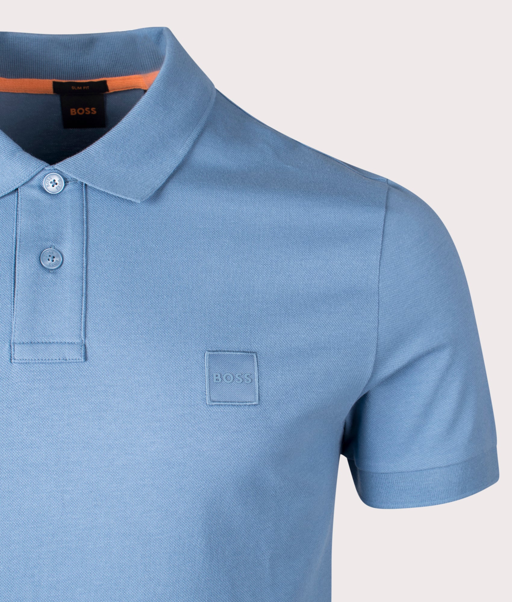 BOSS Slim Fit Passenger Polo Shirt in Open Blue . Shot at EQVVS. Front logo shot 