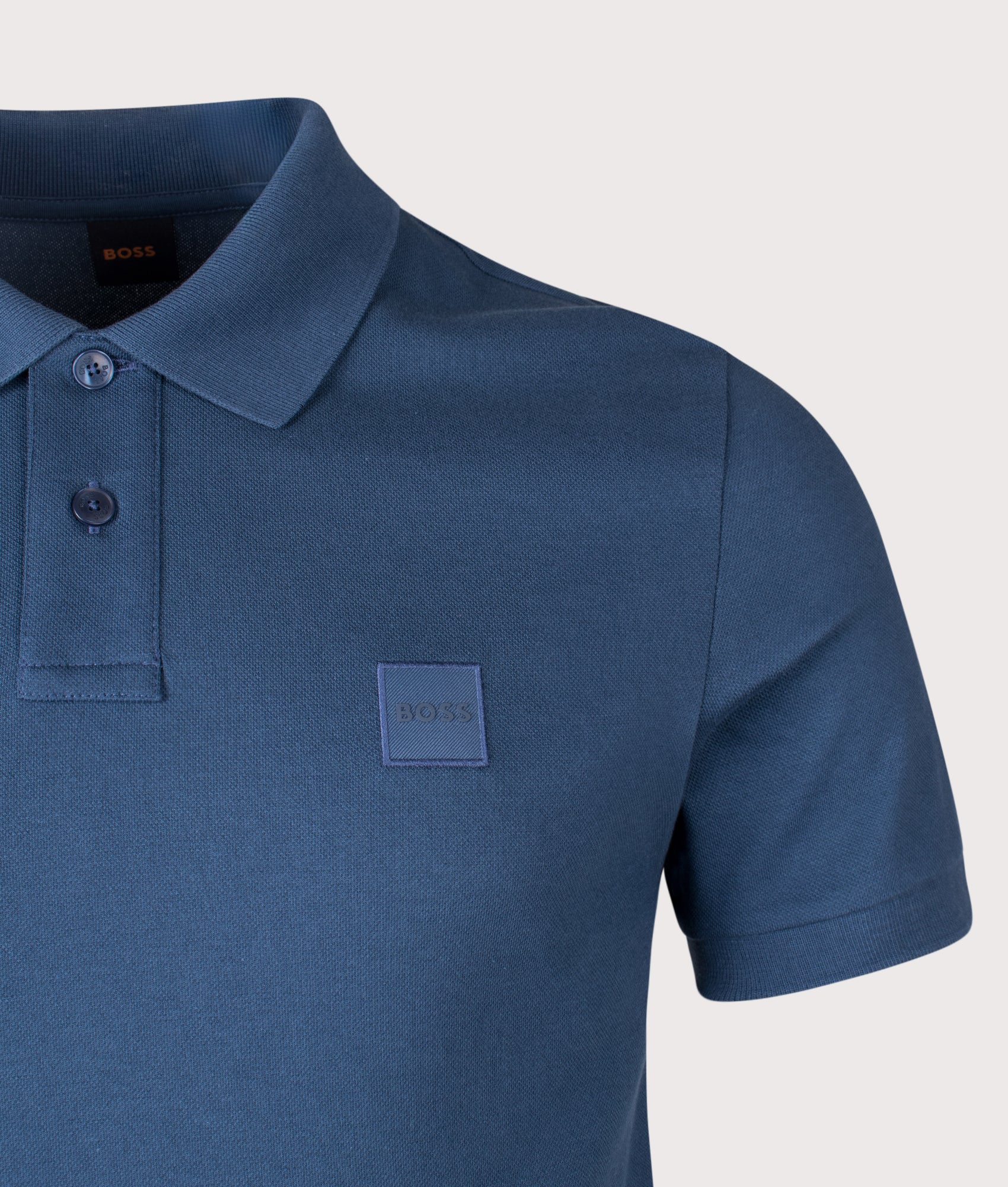 BOSS Slim Fit Passenger Polo Shirt in Open Blue at EQVVS Menswear. Detail shot.