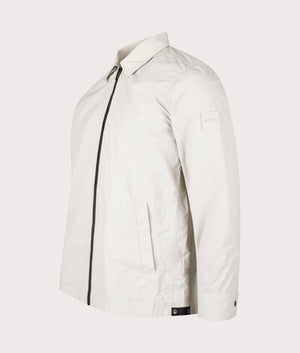 BOSS Oversized Leejay Zip Overshirt in Light Beige at EQVVS. Angle Shot.