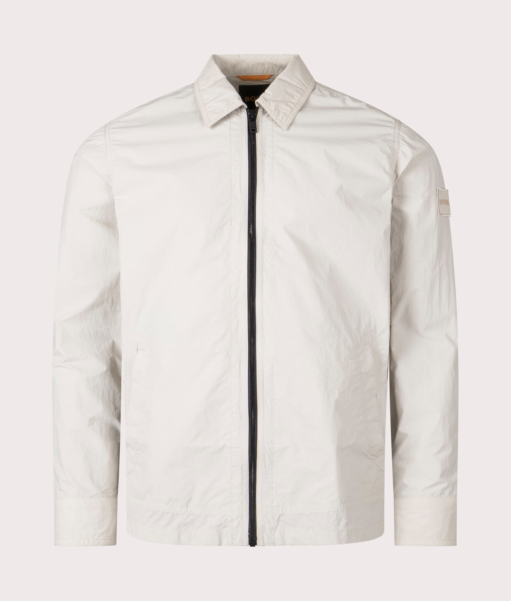 BOSS Oversized Leejay Zip Overshirt in Light Beige at EQVVS. Front Shot.