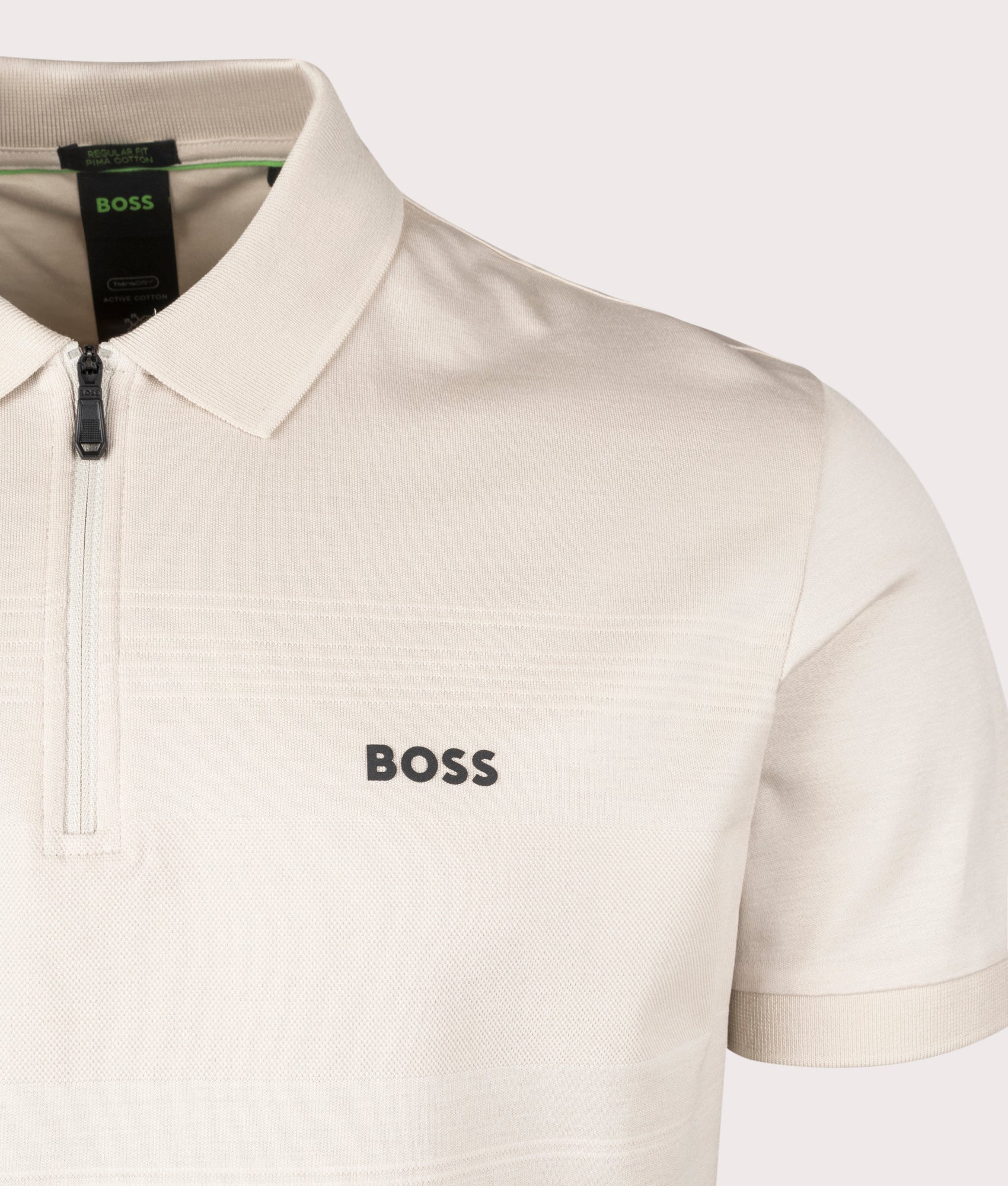 BOSS Philix Pima Polo Shirt in Open Beige. Shot at EQVVS. Front logo shot 