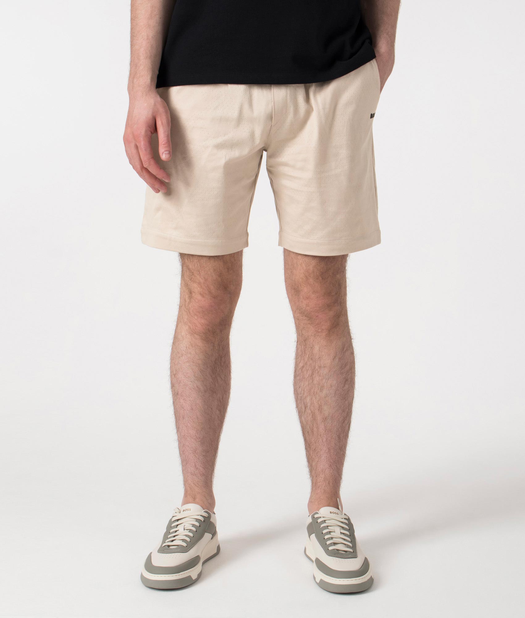 BOSS Relaxed Fit Mesh Heritage Shorts in Open Beige at EQVVS. Front Shot.