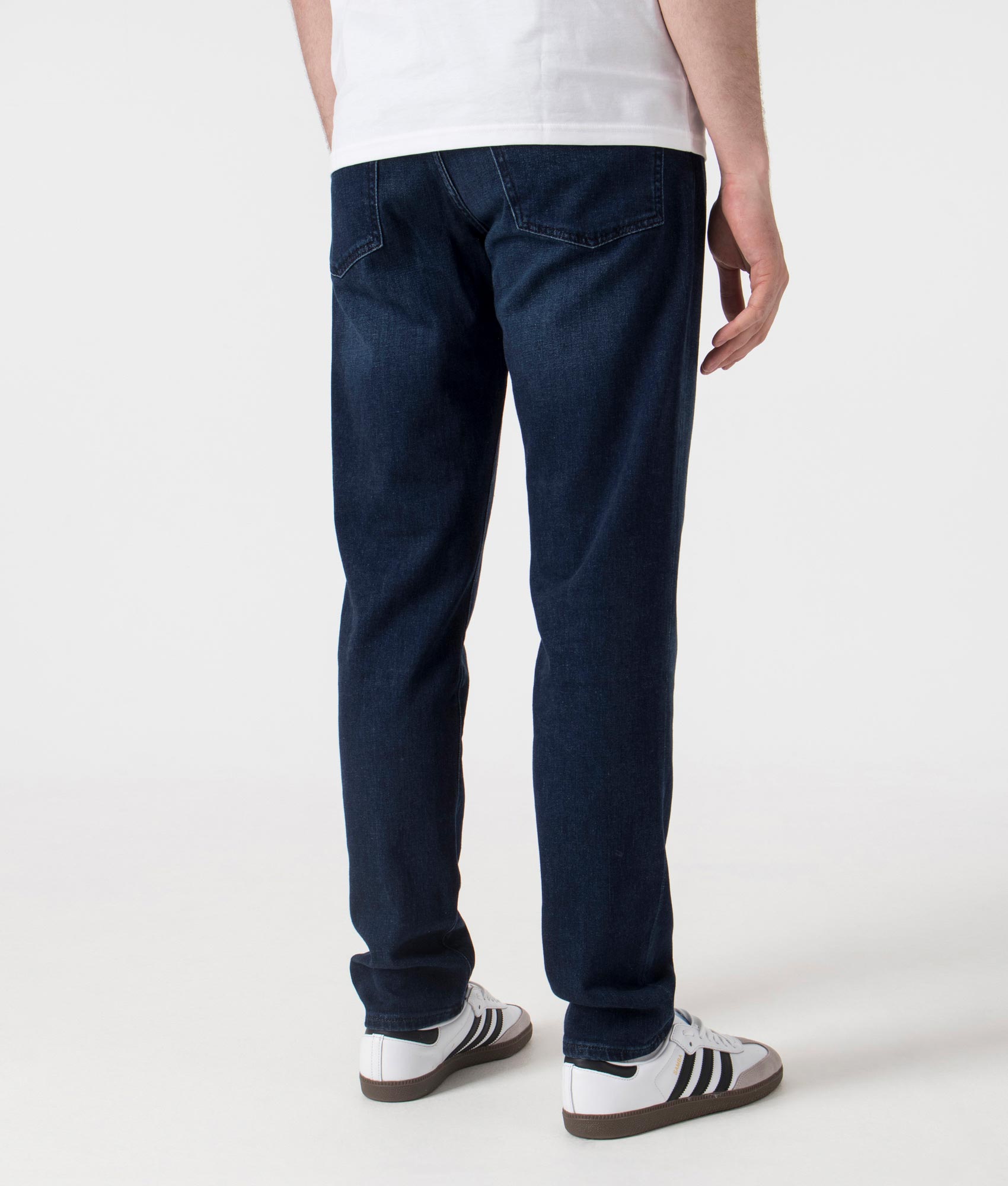 BOSS Tapered Fit ONYX Jeans in Dark Blue . Shot at EQVVS.  Back shot 