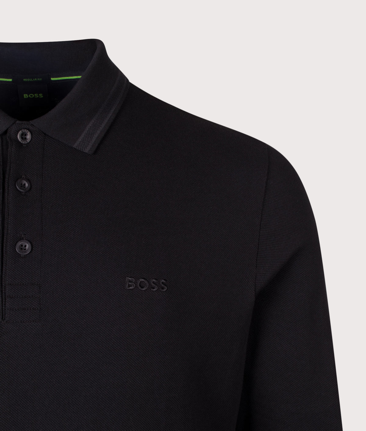 BOSS Regular Fit Plisy Long Sleeve Polo Shirt in Black at EQVVS Menswear. Detail shot.
