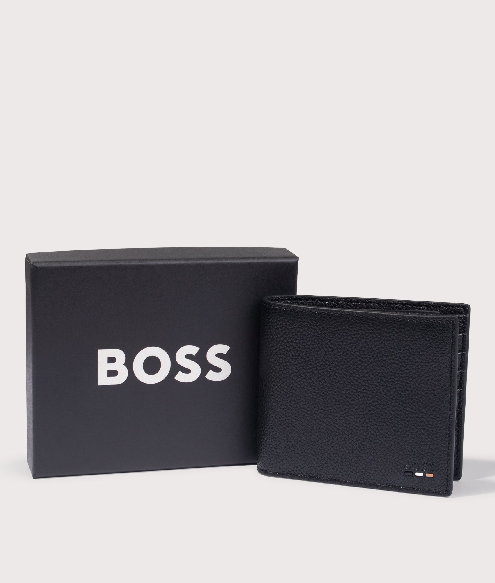Ray Wallet in Black by BOSS. Shot by EQVVS. Package shot.