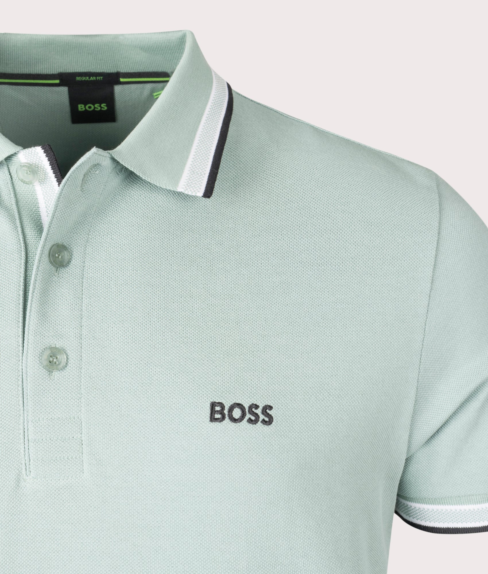 BOSS Paddy Polo Shirt in Open Green . Shot at EQVVS. Front logo shot 