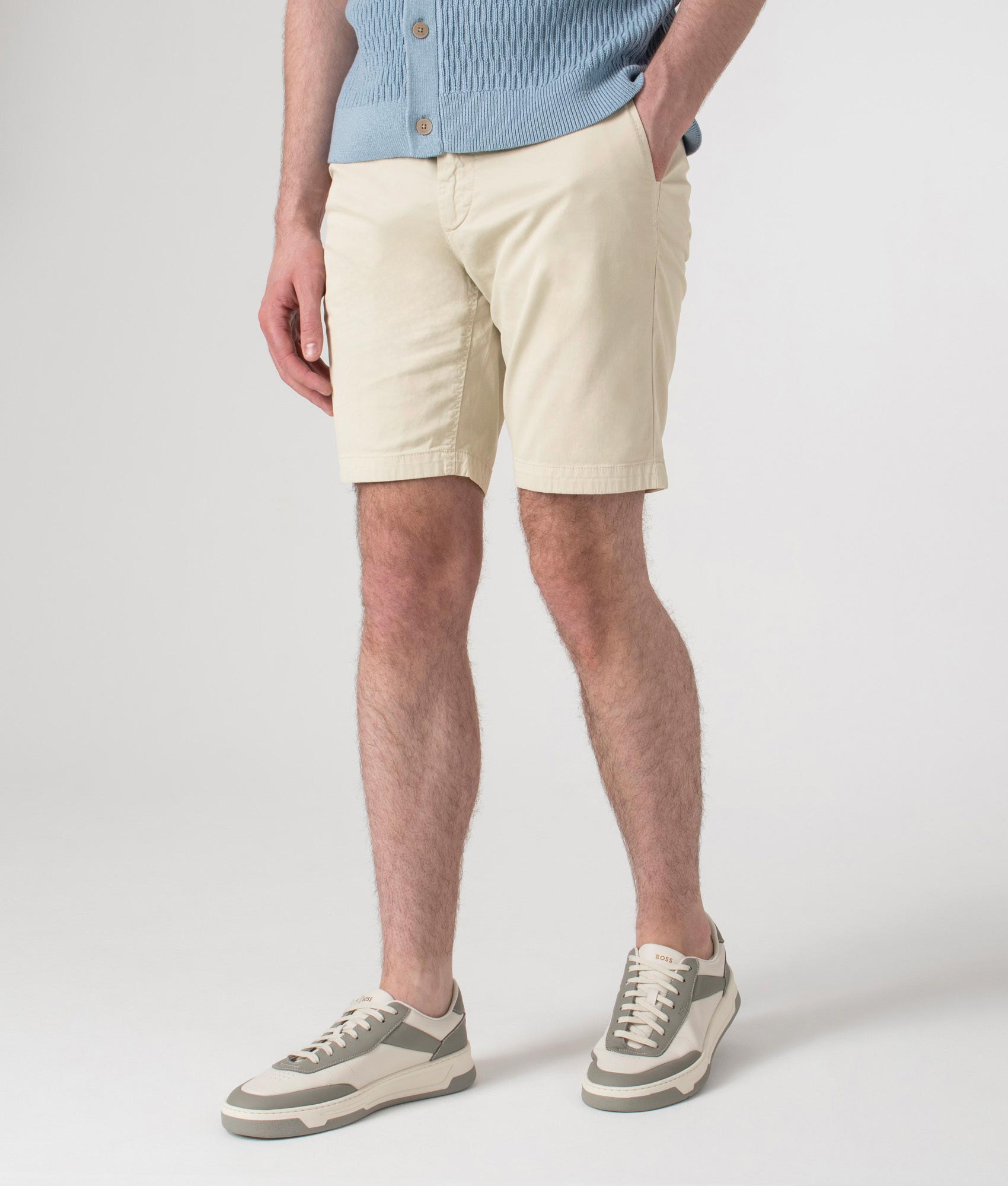 BOSS Slim Fit Chino Shorts in Light Beige at EQVVS. Angle shot.