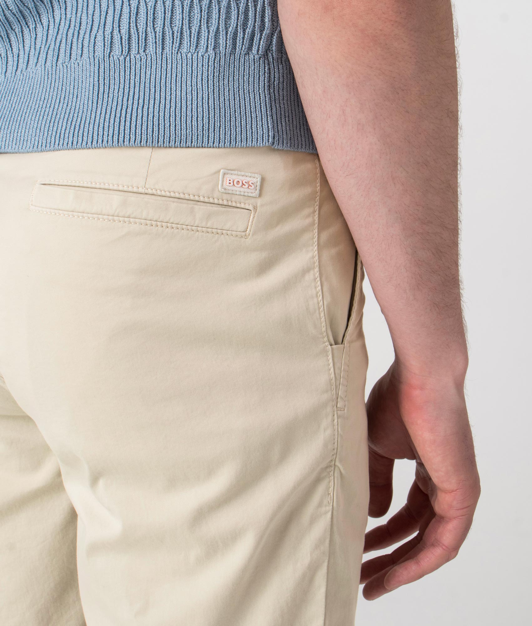 BOSS Slim Fit Chino Shorts in Light Beige at EQVVS. Detail shot.