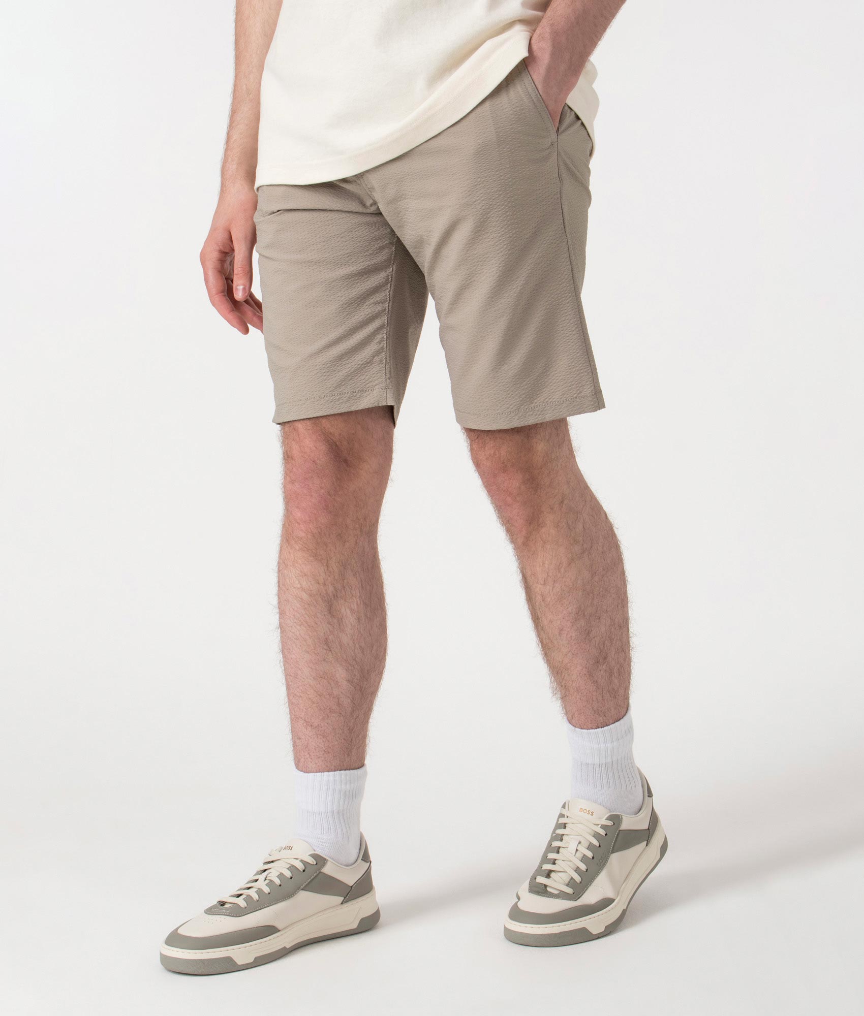 BOSS Regular Fit Tapered Chino Shorts in Open Beige at EQVVS. Angle Shot.