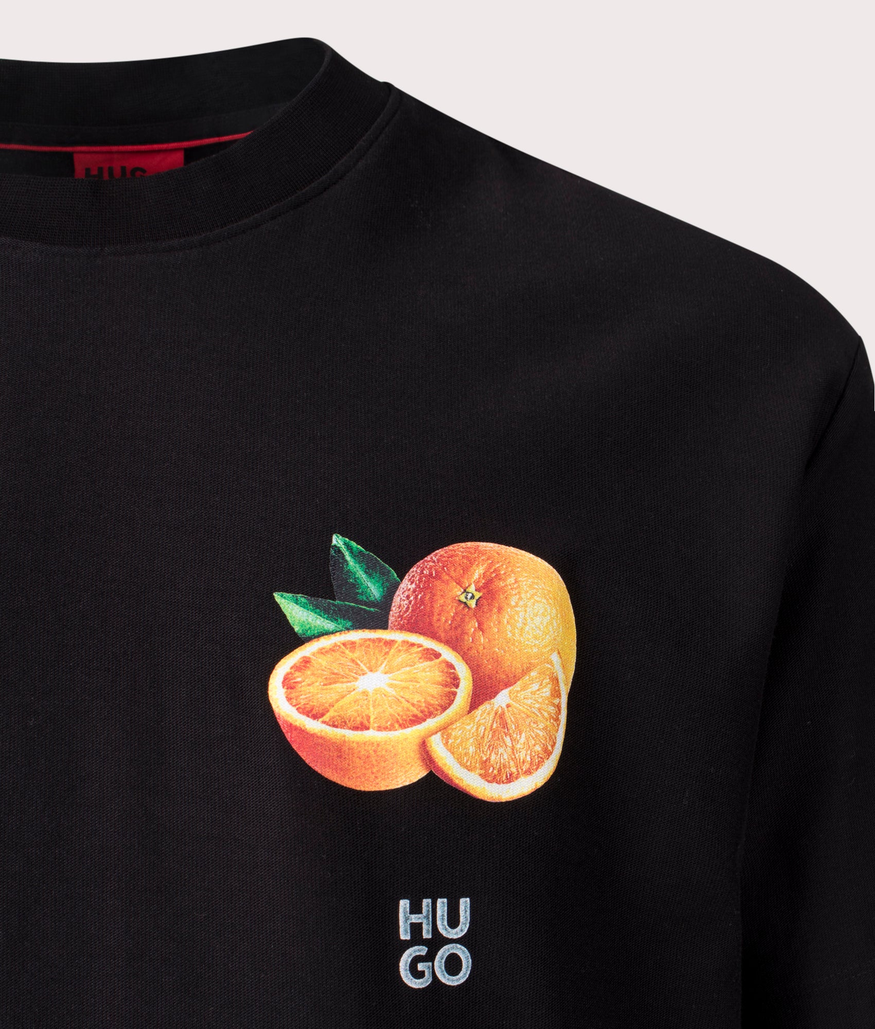 HUGO Oversized Dartiee T-Shirt in Black, 100% Cotton at EQVVS. Close-up shot. 