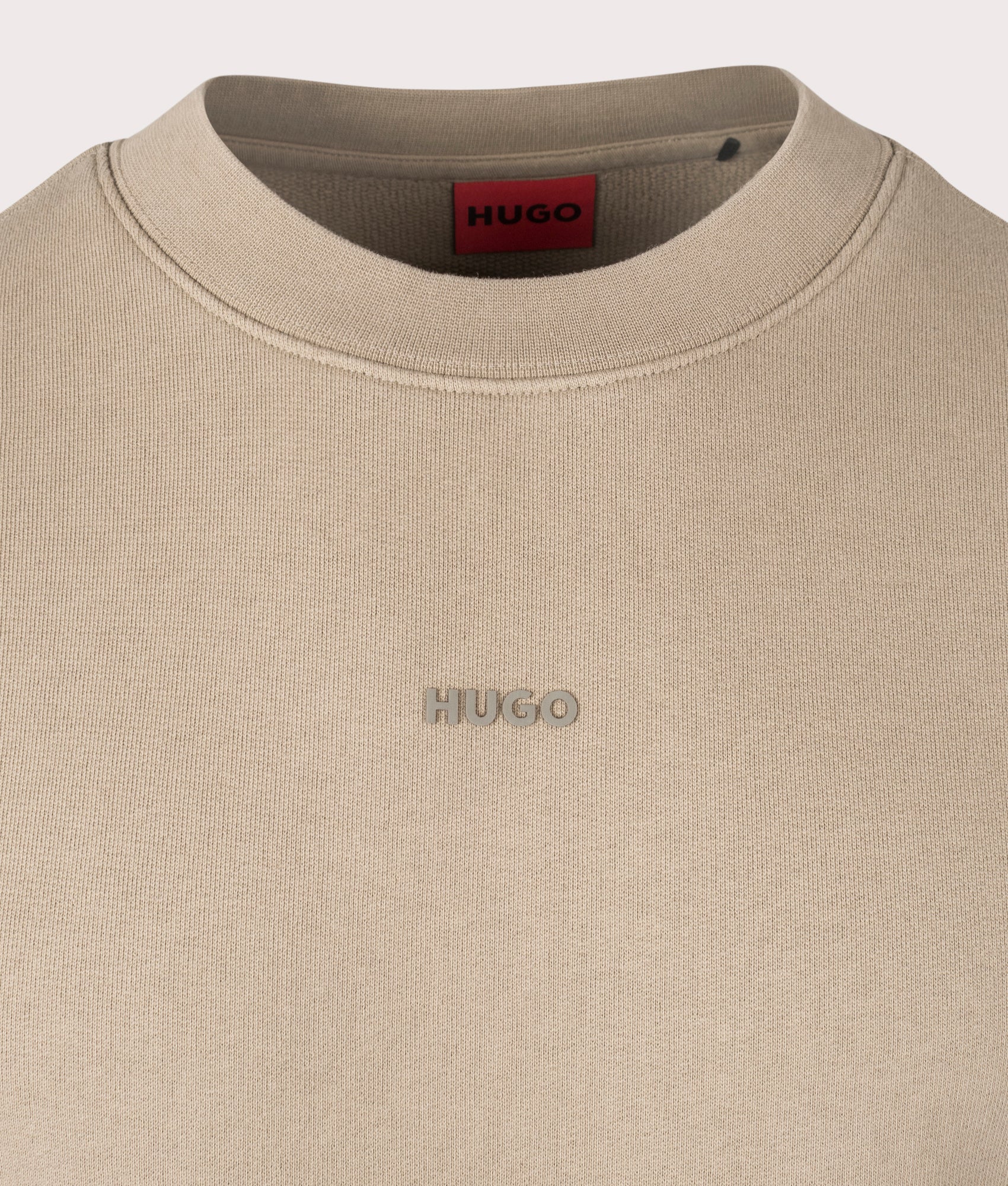 Hugo Relaxed Fit Dopaly Sweatshirt in Medium Brown. Shot at EQVVS. Front logo shot 