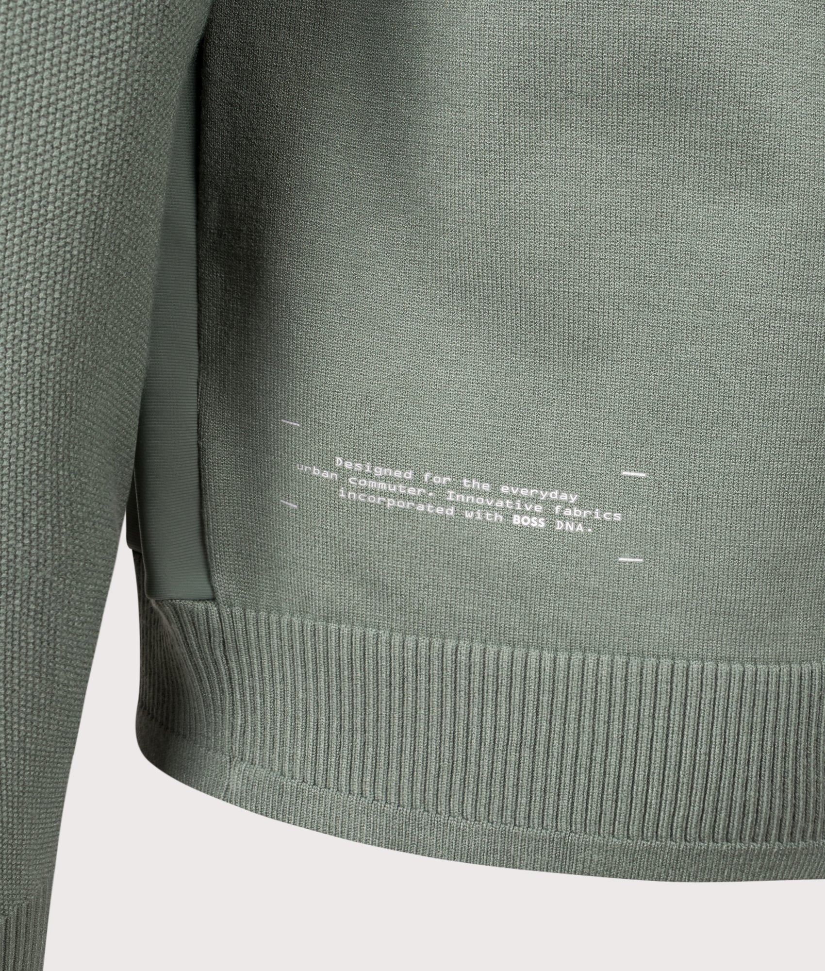 Civic Quarter Zip Hybrid Knit Sweatshirt in Open Green | BOSS | EQVVS | Front hem detail shot 