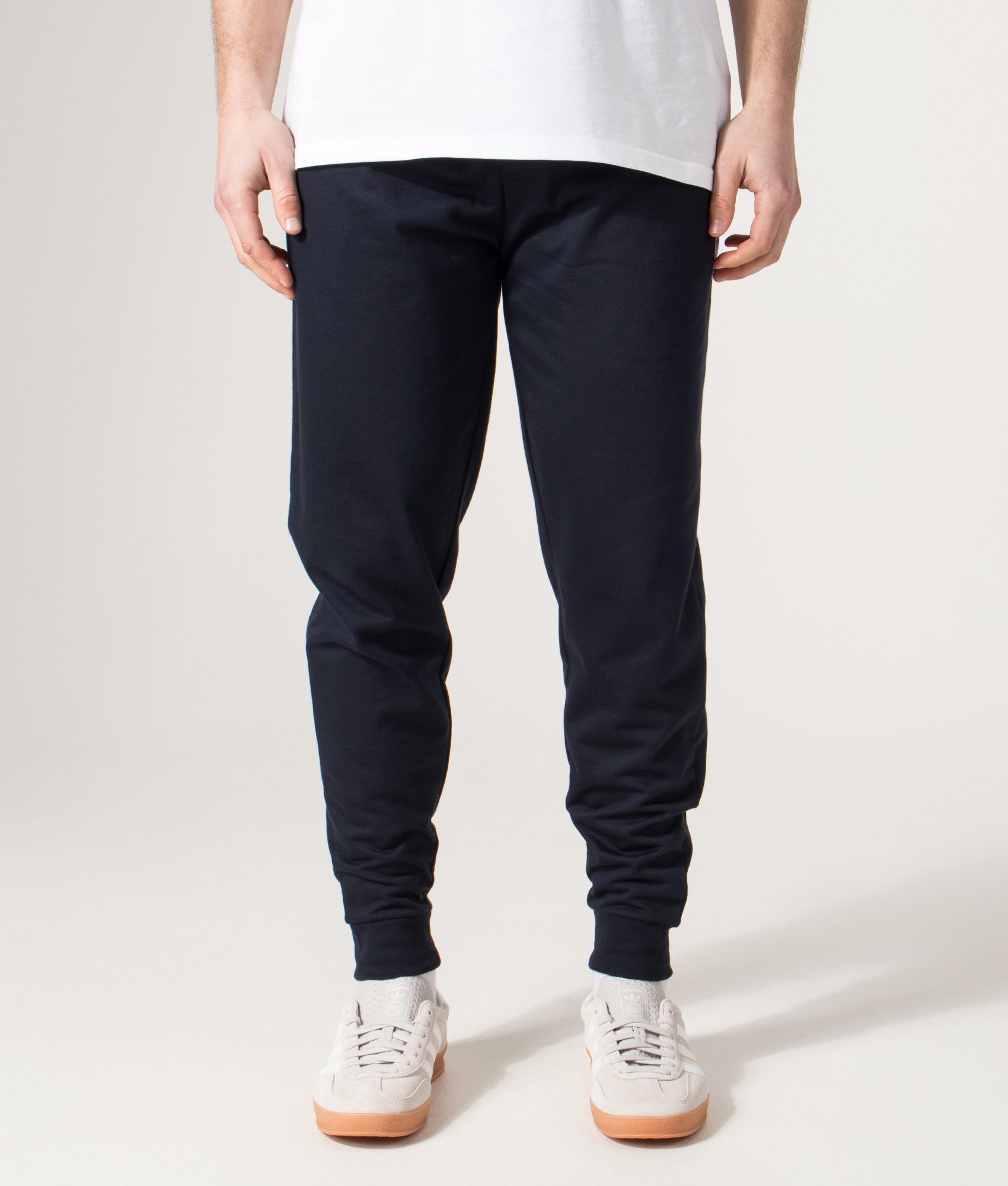 BOSS Authentic Track pants in Dark Blue at EQVVS Menswear. Model front shot.