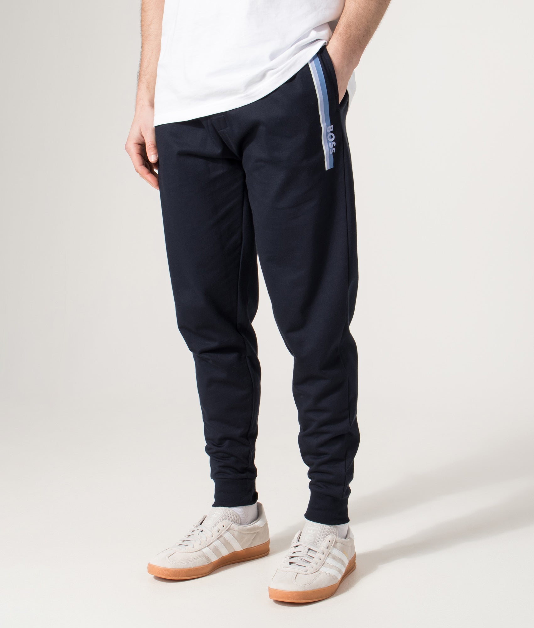 BOSS Authentic Track pants in Dark Blue at EQVVS Menswear. Angled model front shot.