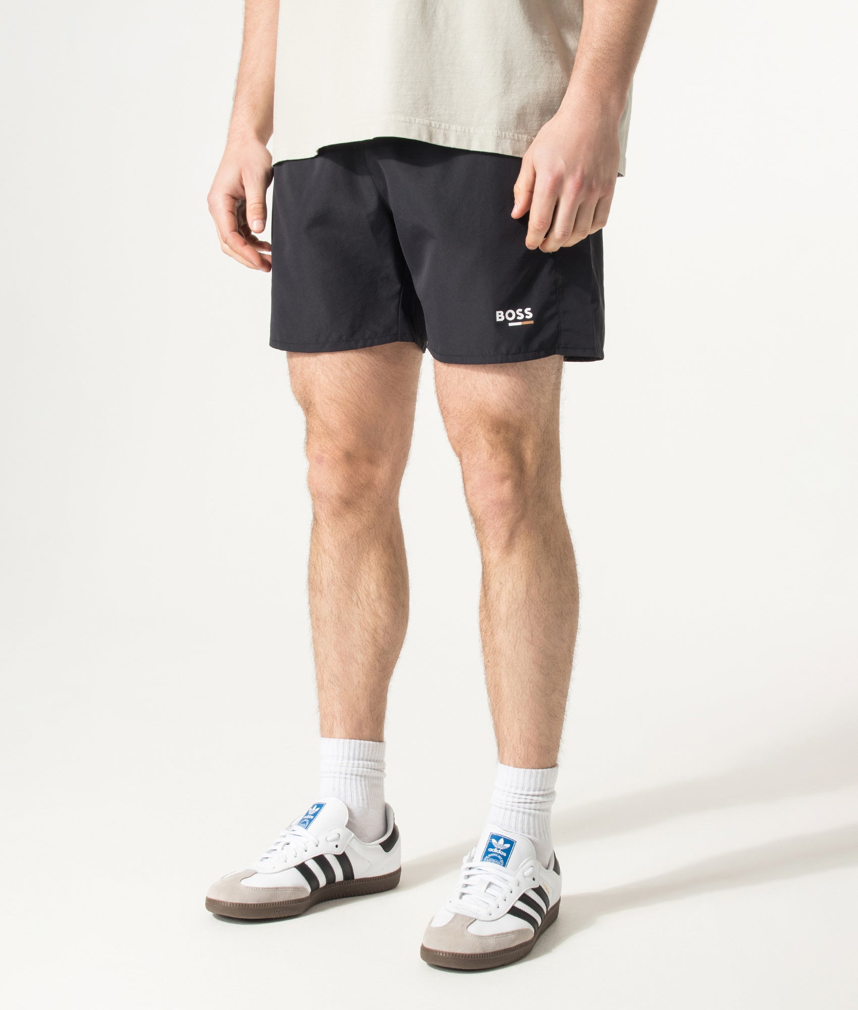 BOSS Swordfish Swim Shorts in Black at EQVVS Menswear. Angled model front shot.