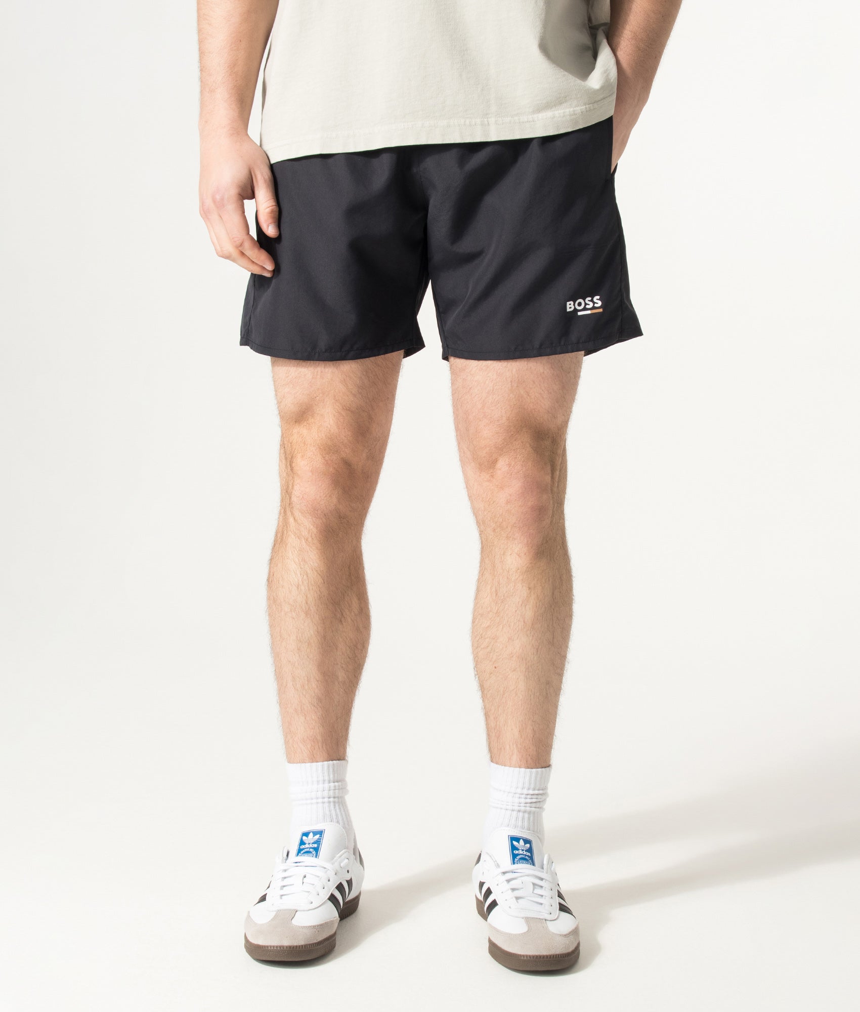 BOSS Swordfish Swim Shorts in Black at EQVVS Menswear. Model front shot.