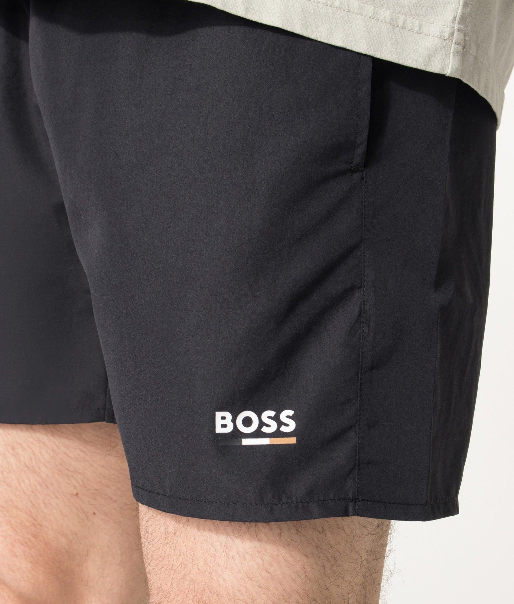 BOSS Swordfish Swim Shorts in Black at EQVVS Menswear. Detail shot.