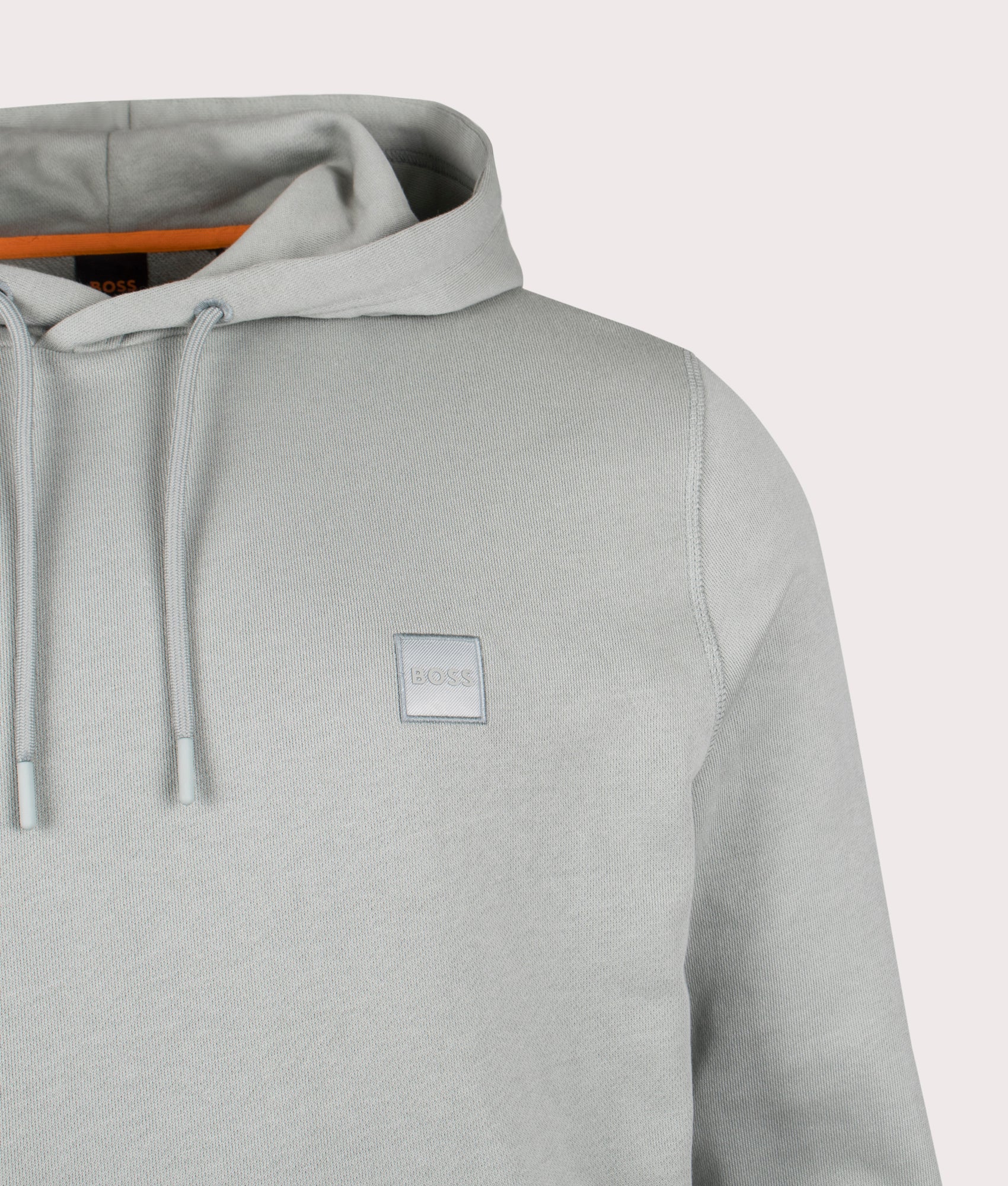 Wetalk Hoodie in Open Green. 100% Cotton | BOSS | Shot at EQVVS | Front detail shot 