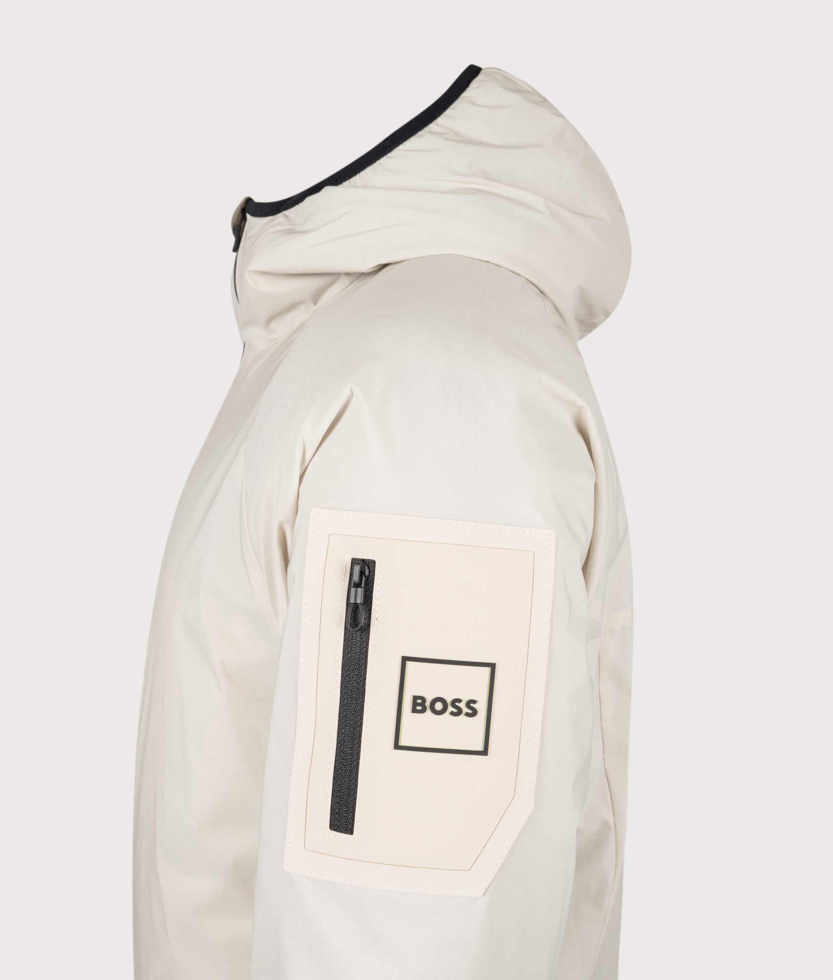 BOSS Lite X Hooded Jacket in Light Beige at EQVVS Menswear. Detail shot.