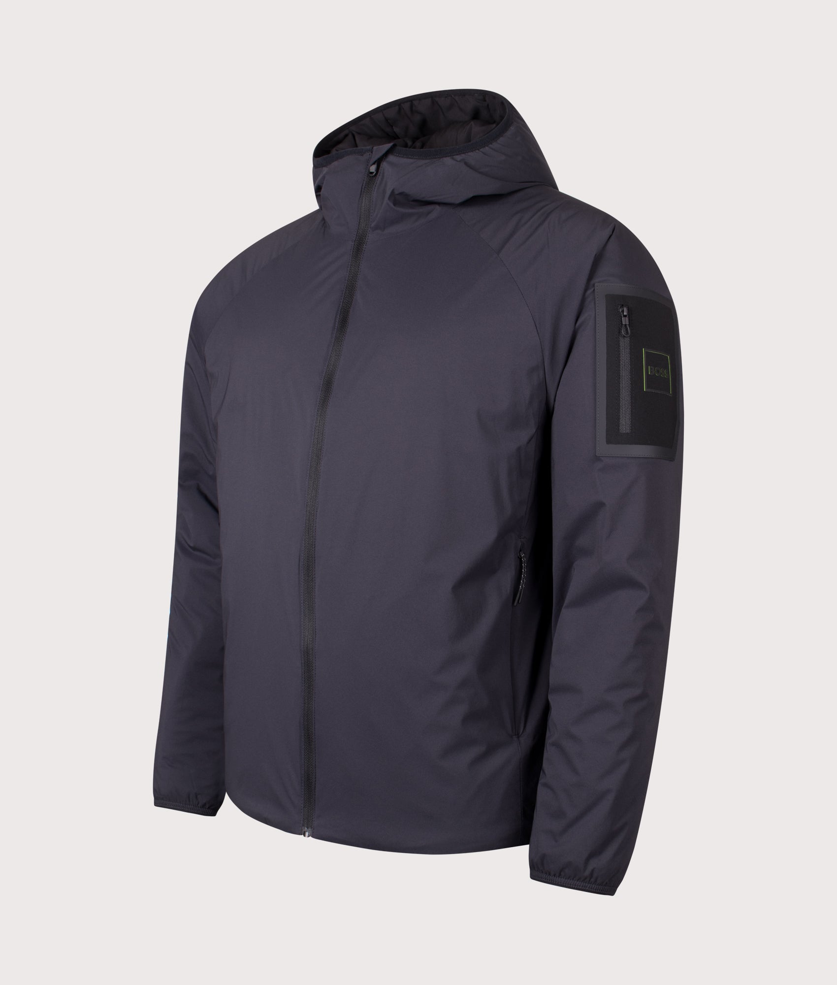 BOSS Lite X Hooded Jacket in Dark Blue at EQVVS Menswear. Angled front shot.