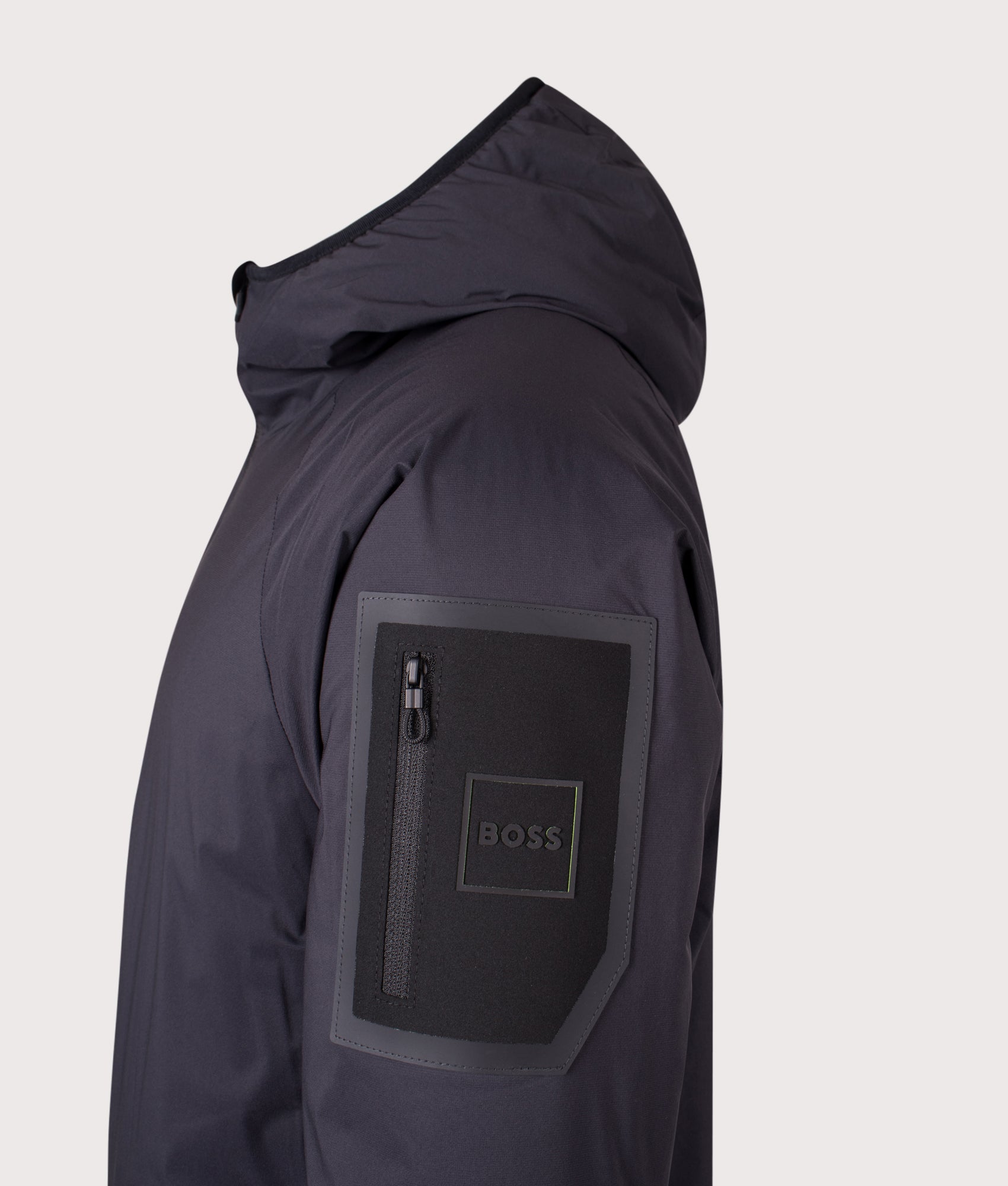 BOSS Lite X Hooded Jacket in Dark Blue at EQVVS Menswear. Side detail shot.