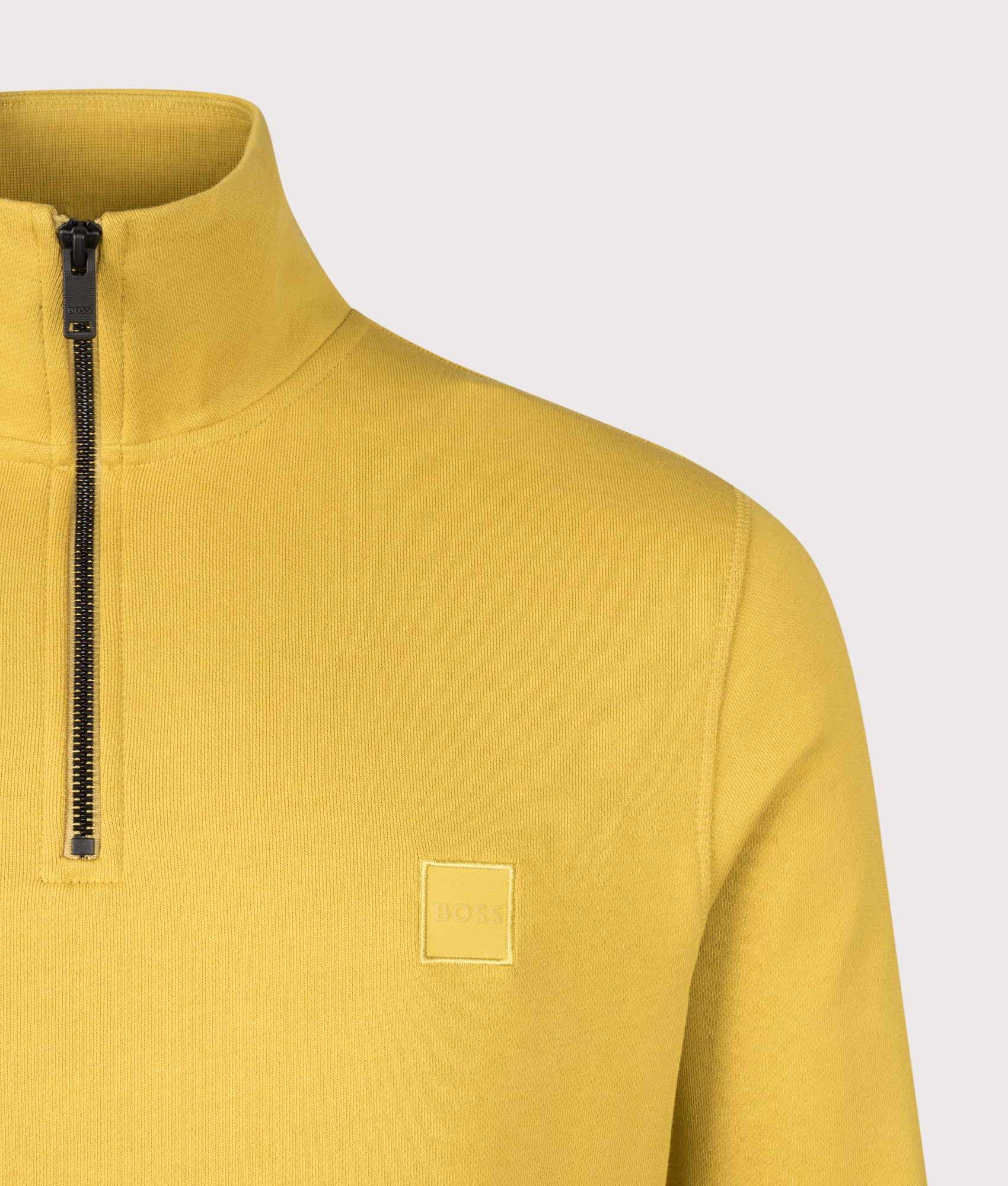 BOSS Quarter Zip Zetrust Sweatshirt in Medium Yellow at EQVVS Menswear. Detail shot.