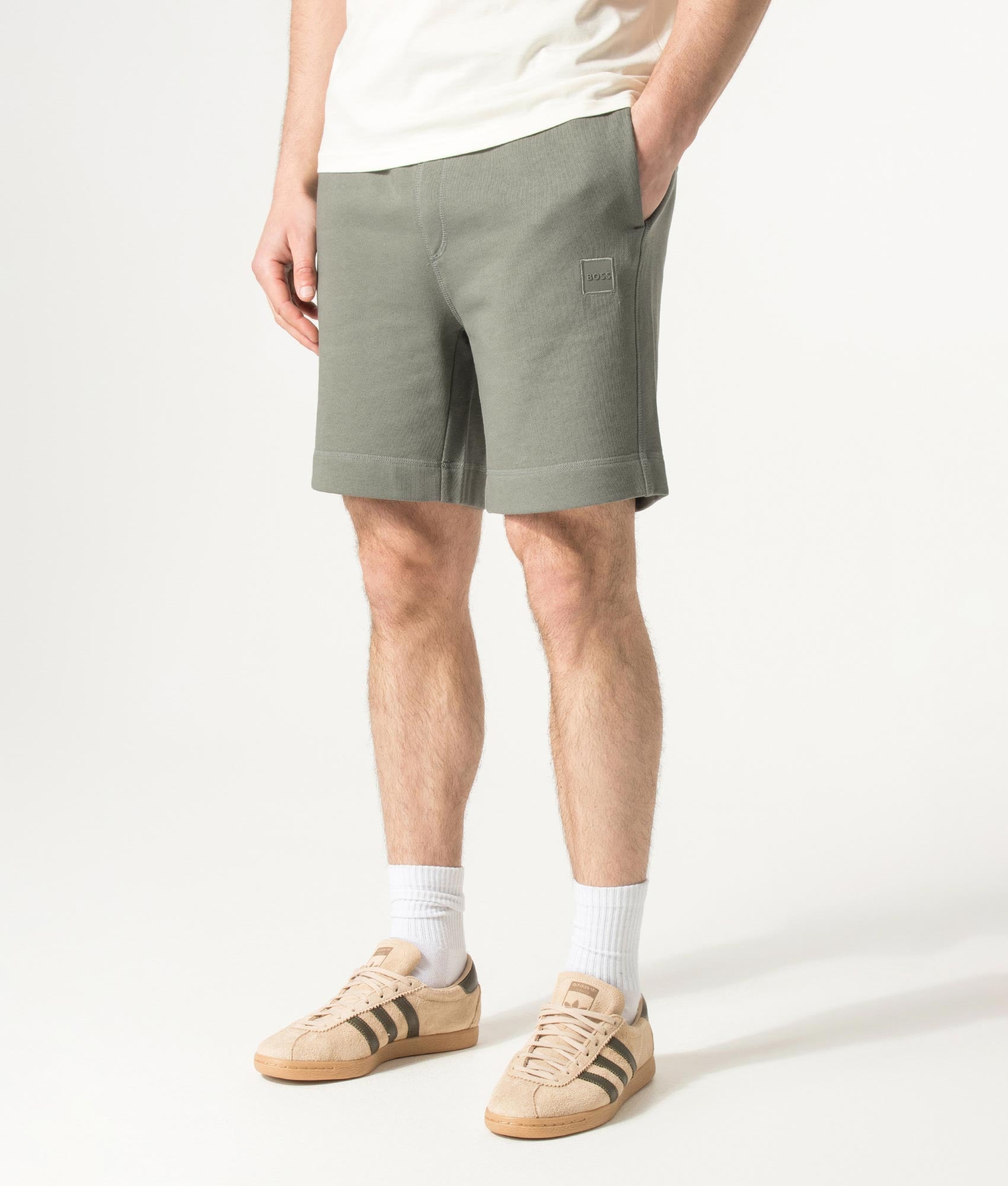 BOSS Sewalk Sweat Shorts in Open Grey at EQVVS Menswear. Angled model front shot.