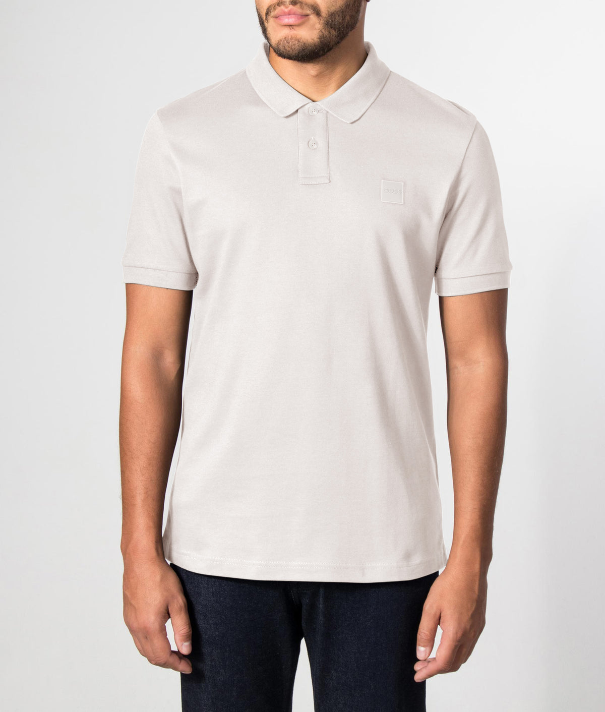 BOSS Slim Fit Passenger Polo Shirt in Open Grey at EQVVS Menswear. Front model shot.