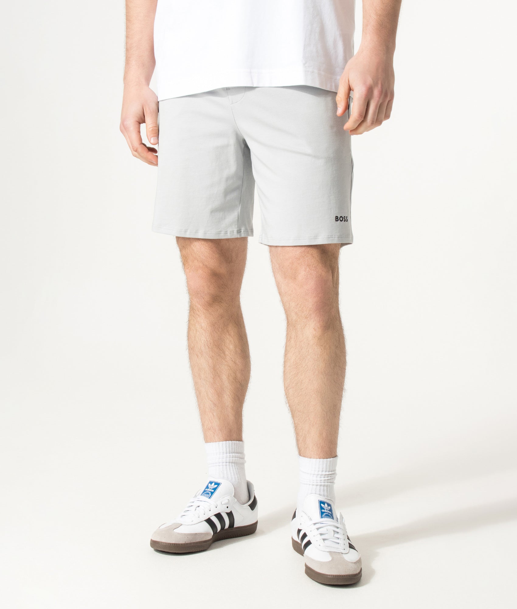BOSS Unique Lounge Shorts in Light/Pastel Grey at EQVVS Menswear. Model front shot.