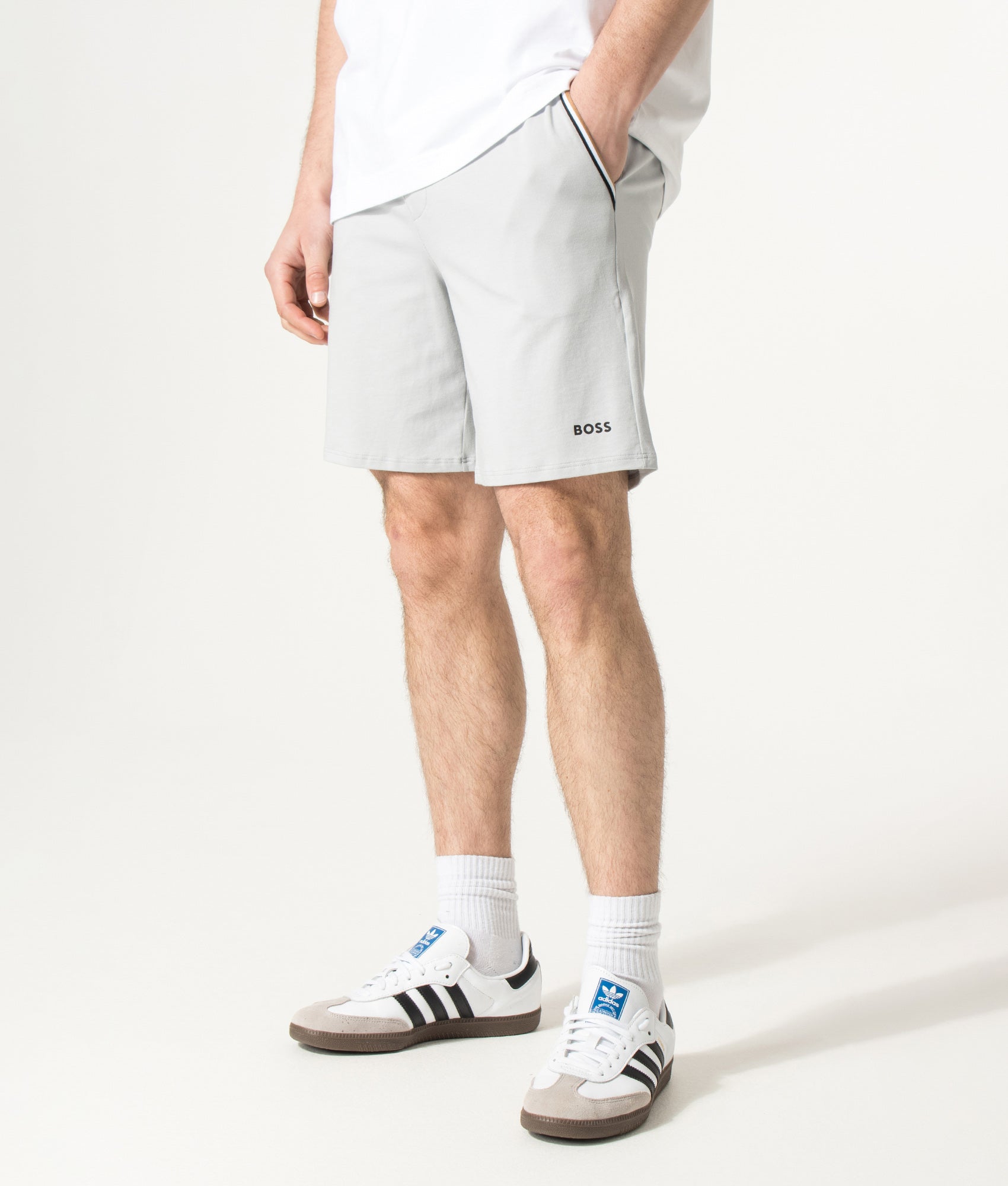 BOSS Unique Lounge Shorts in Light/Pastel Grey at EQVVS Menswear. Angled model front shot.